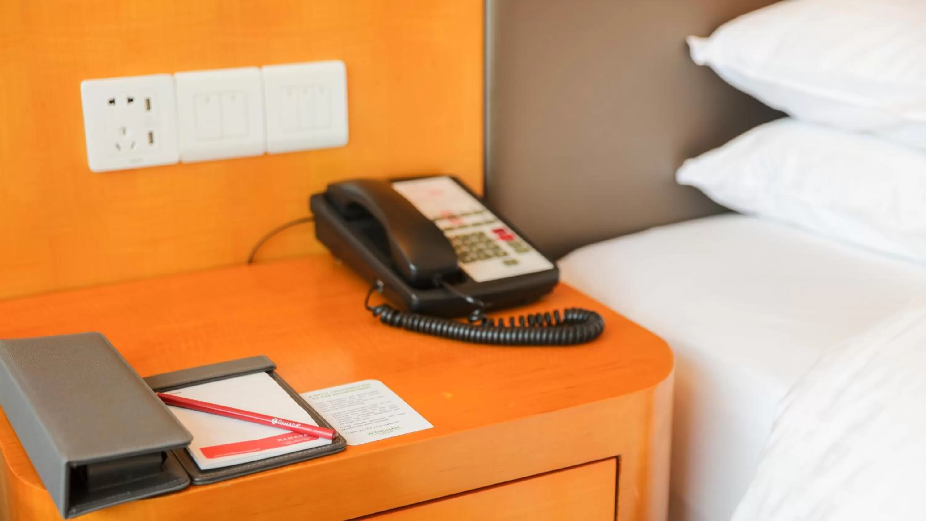 Bed in Ramada Plaza Shanghai Pudong Airport