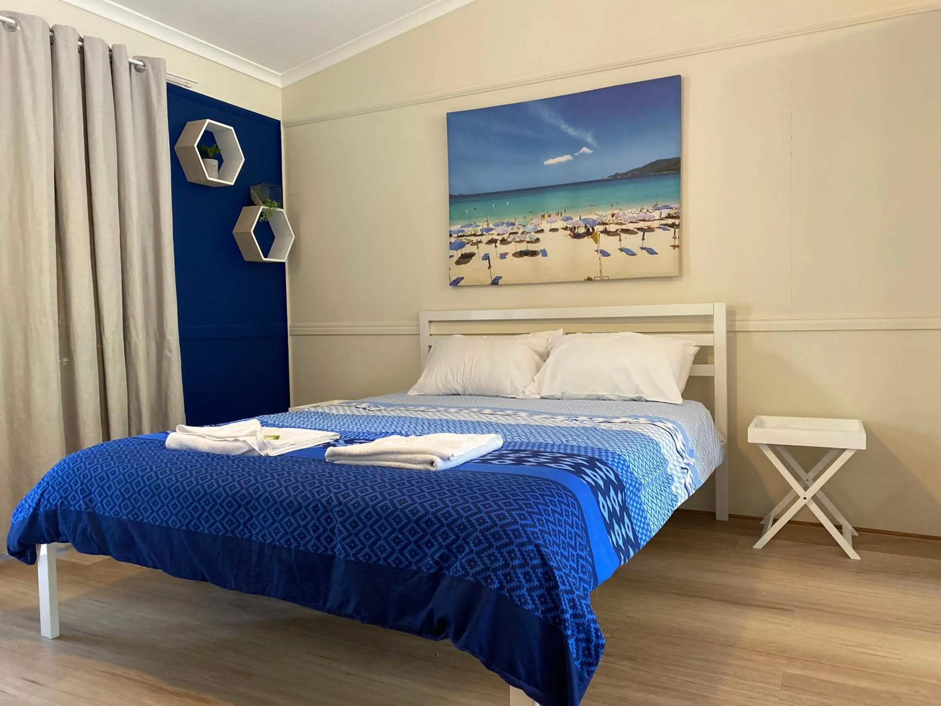 Bed in Colonial Village Resort