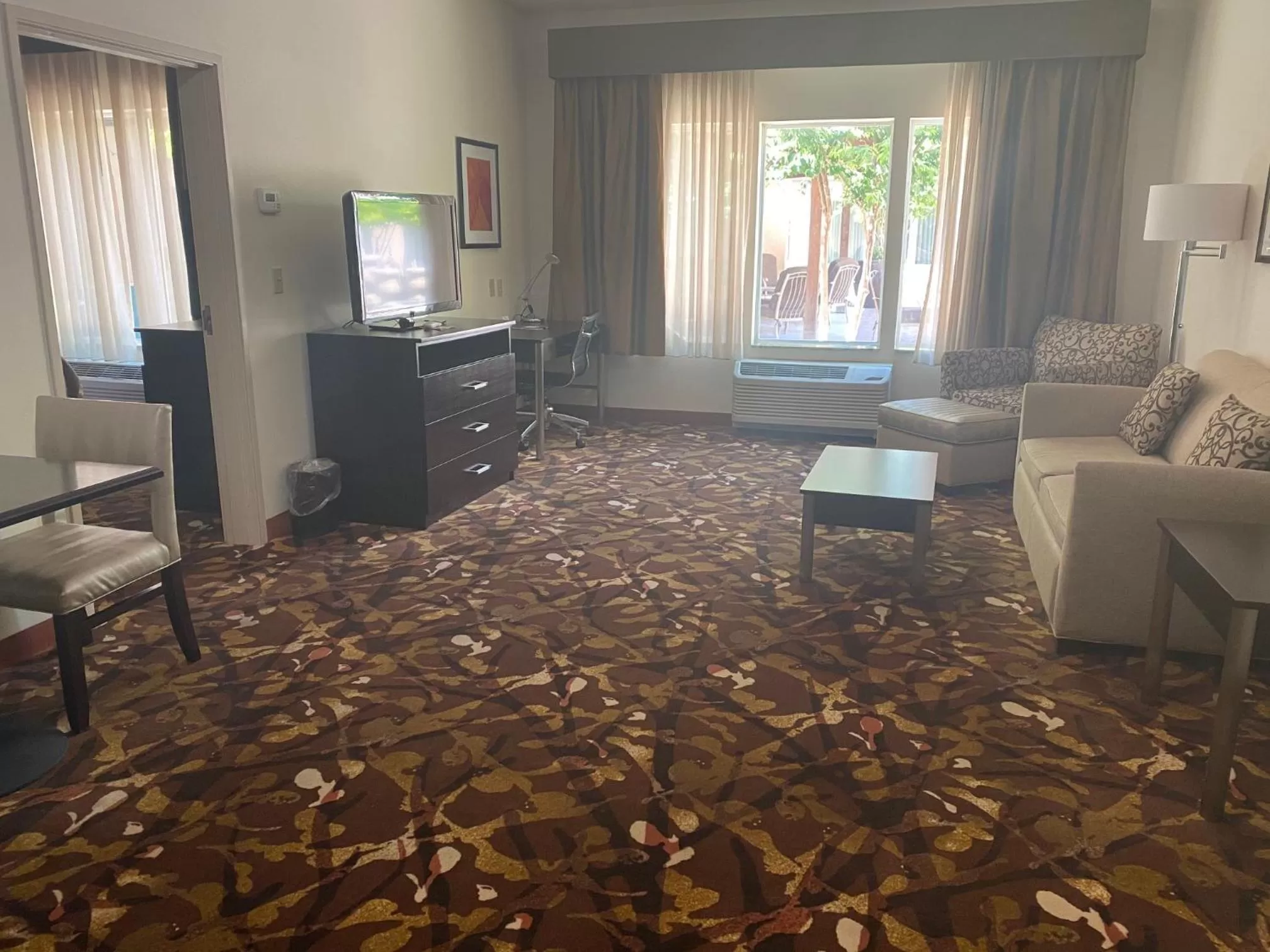 Living room in Baymont by Wyndham Hobbs