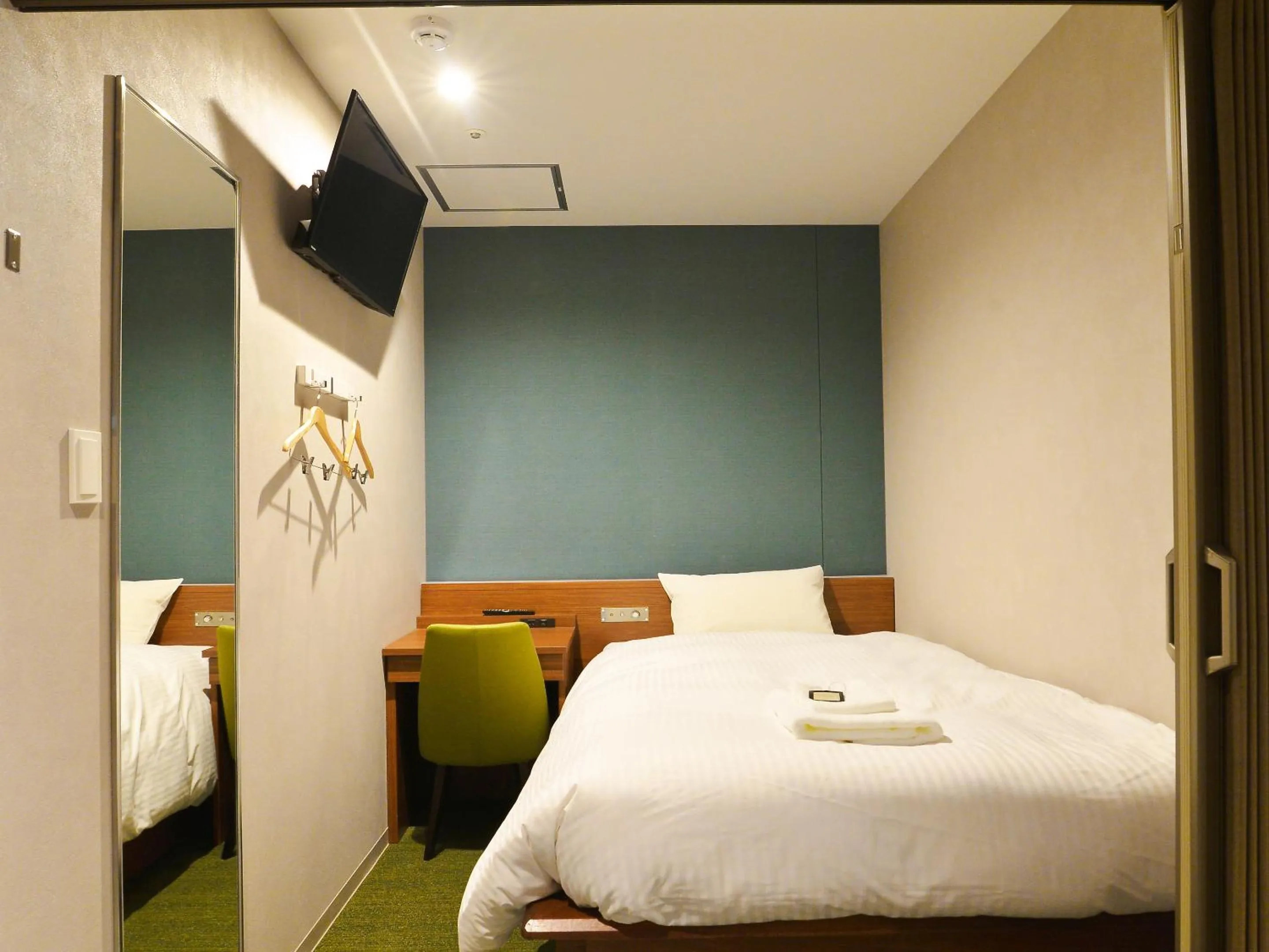 Bed in Gardens Cabin