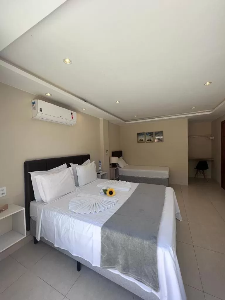 Bed in Pousada Arraial Tropical