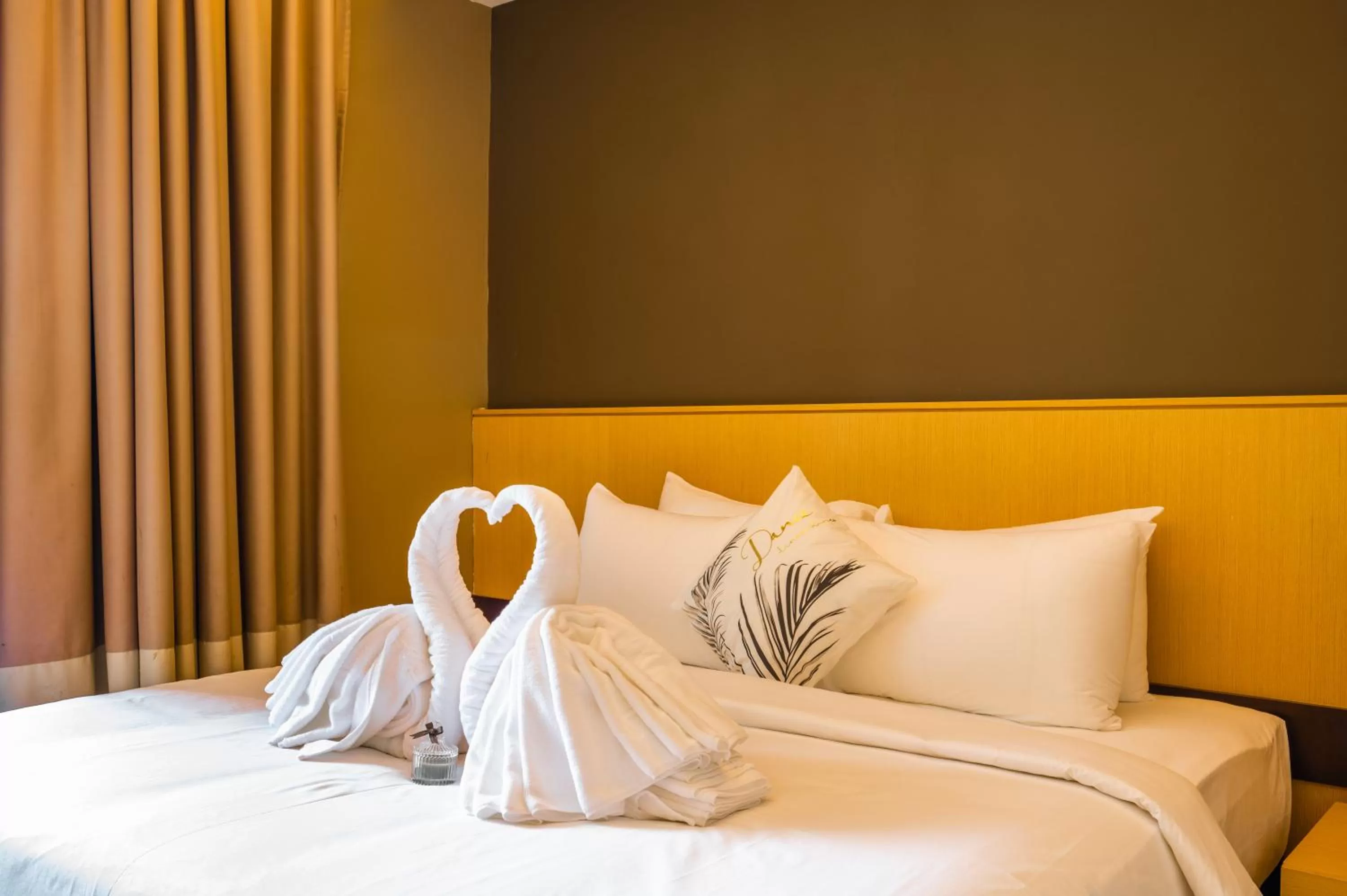 Bed in Greystone 99 Suites