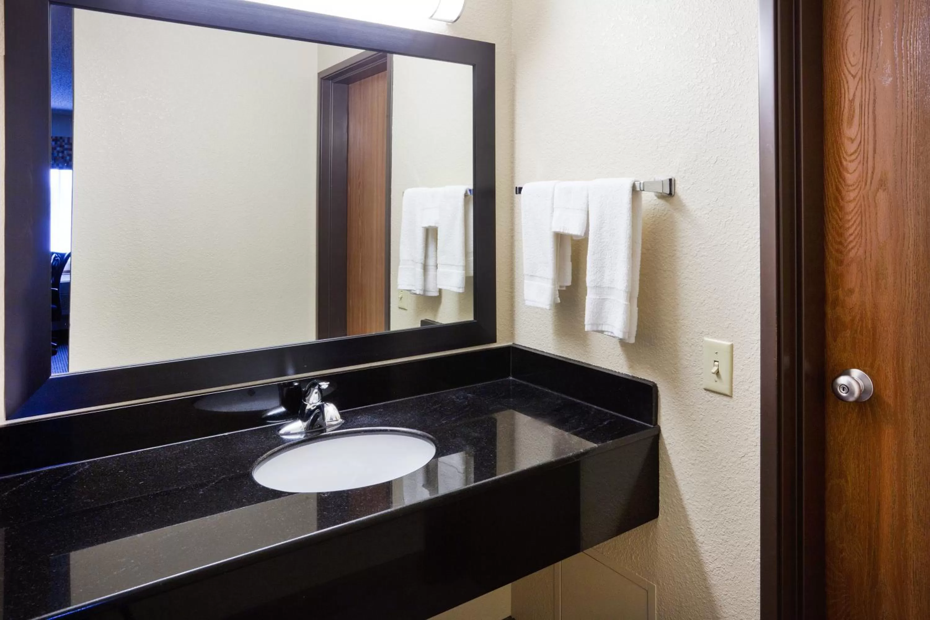 Bathroom in AmericInn by Wyndham Plover Stevens Point