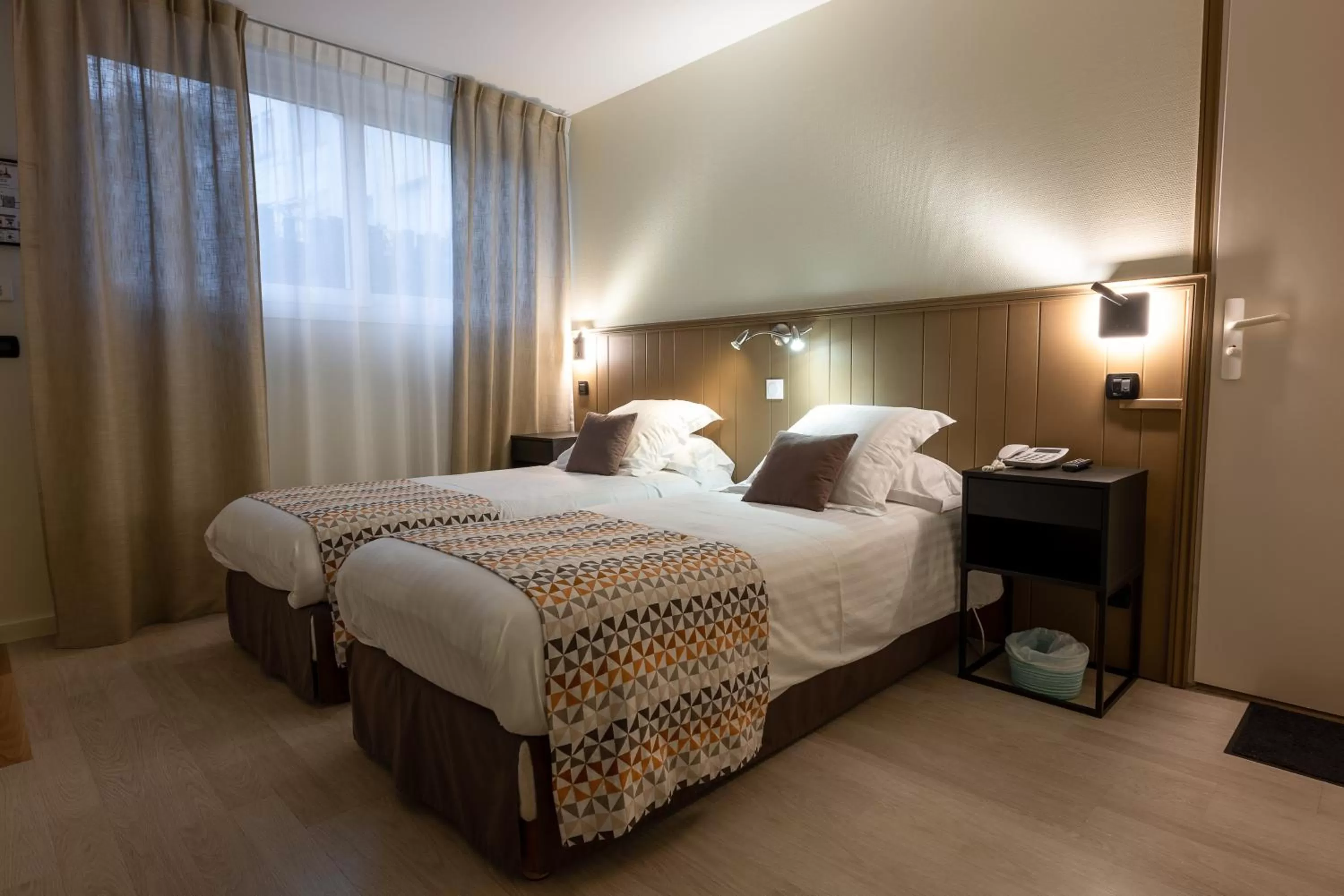 Bed in Logis Hôtel Rêve de Sable