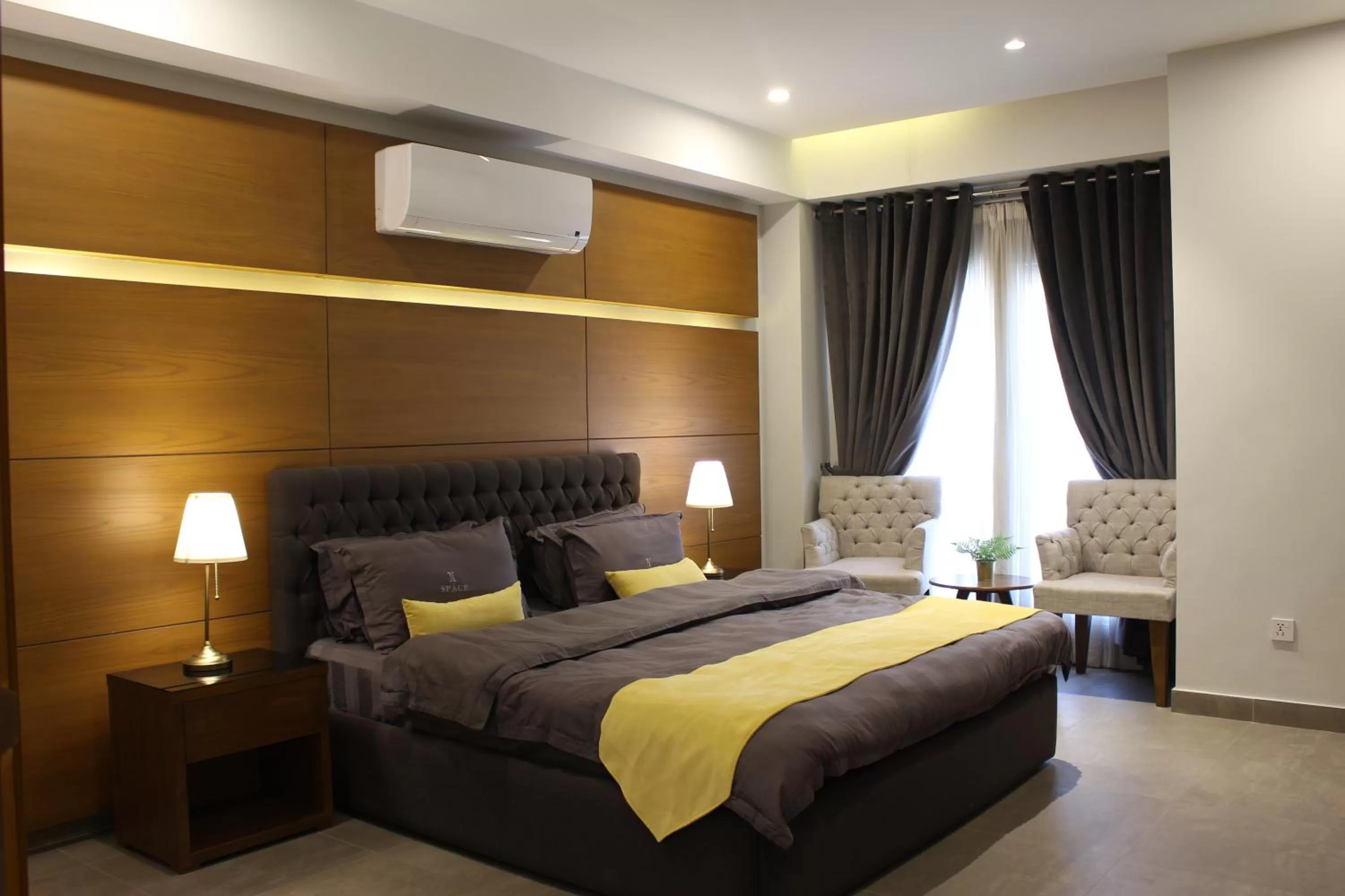 Bed in SPACE Luxury Rental Suites