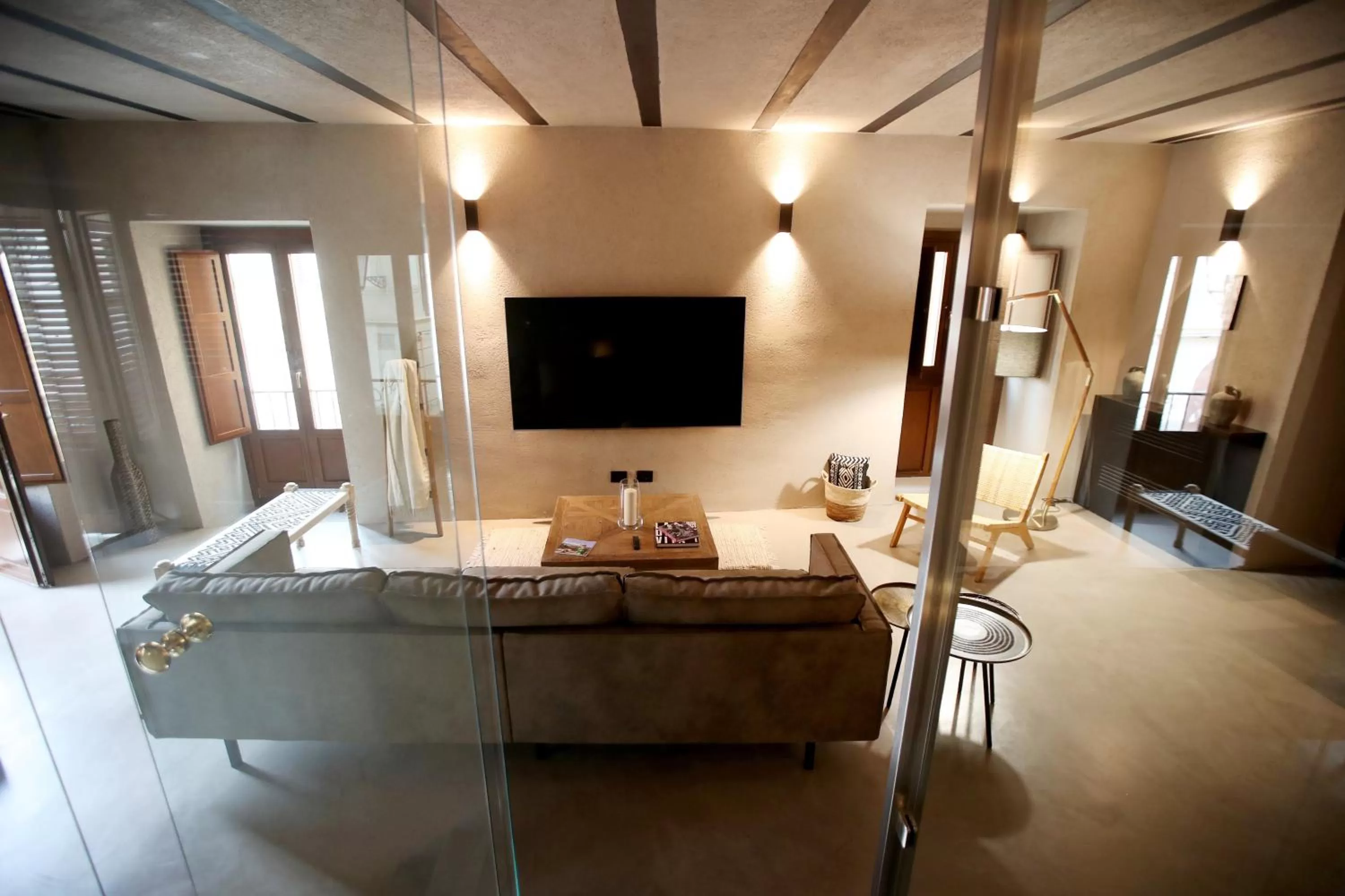 Communal lounge/ TV room in Casa Nostra Luxury Suites & Spa