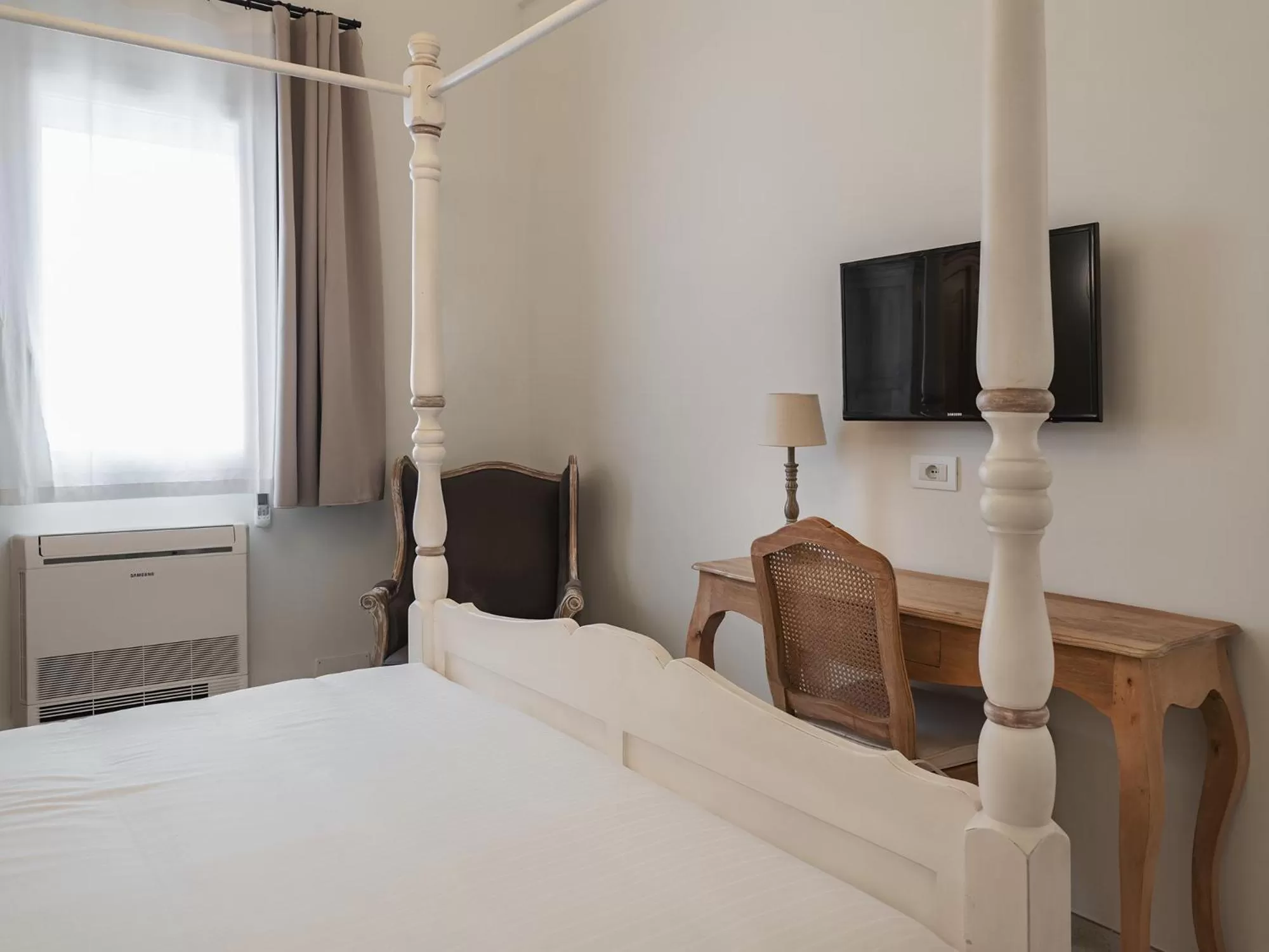 Photo of the whole room, Bed in Living u HomeSuites