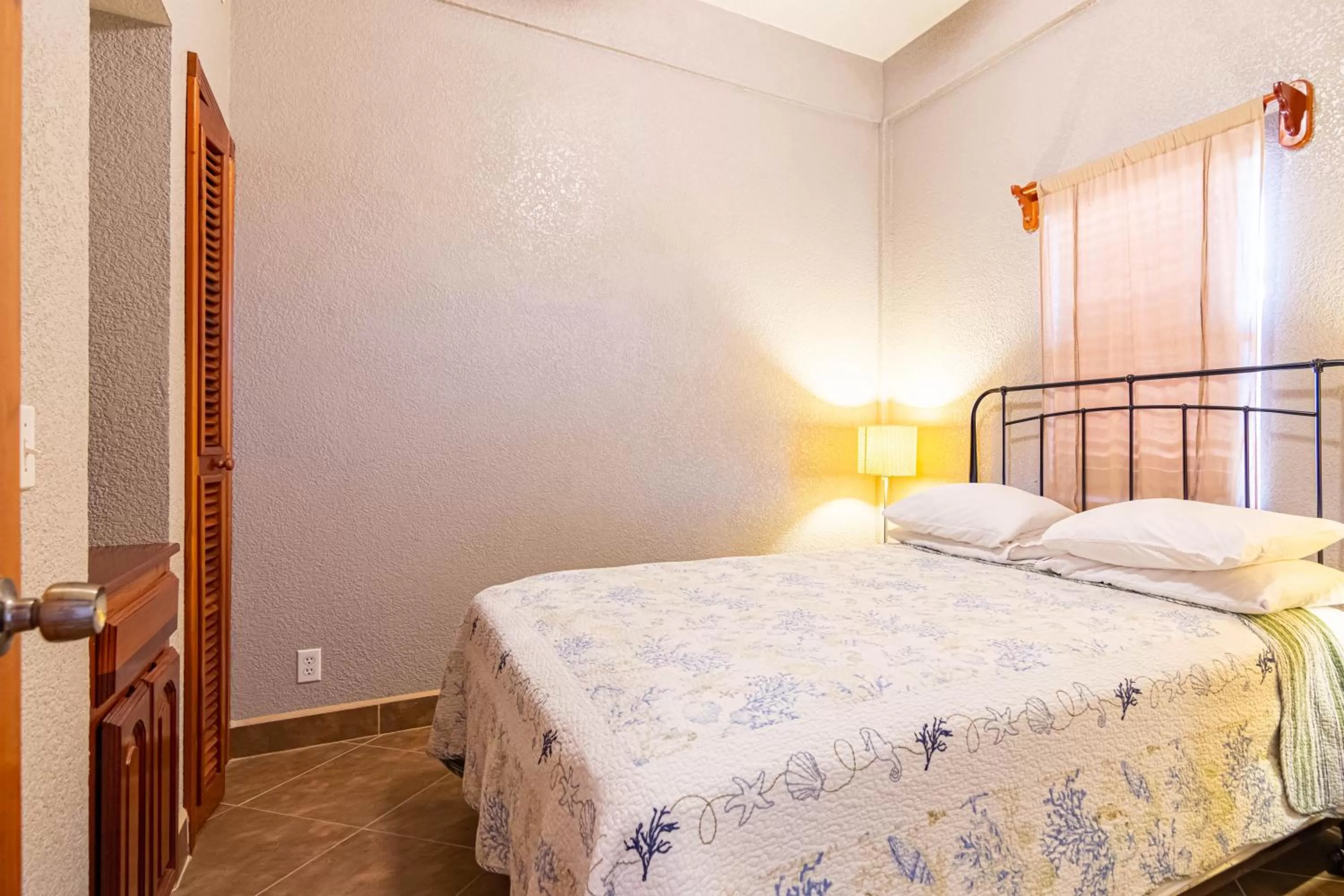 Bed in Lighthouse Beach Villas