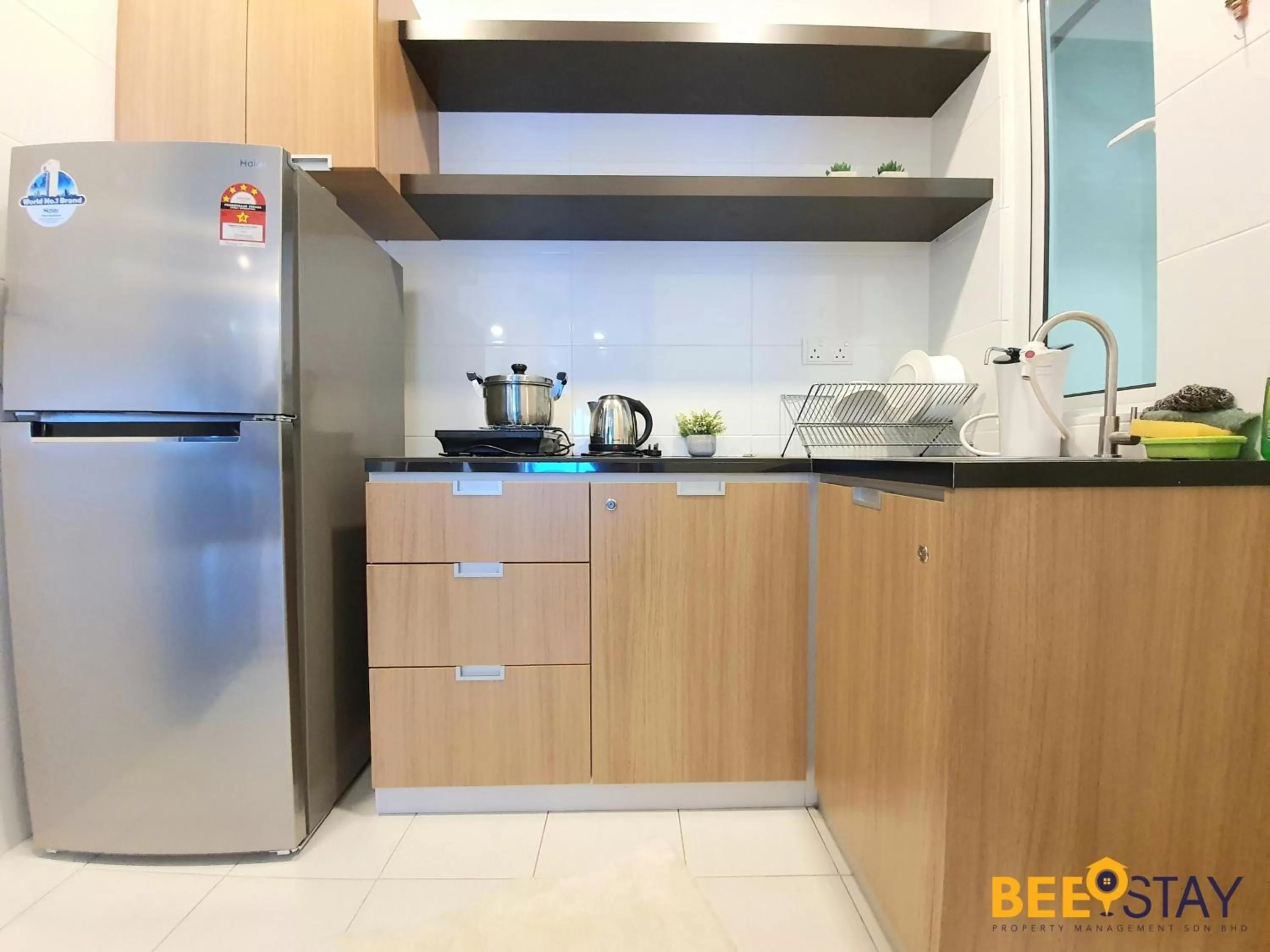 Kitchen/Kitchenette in The Wave Suites Melaka by BEESTAY