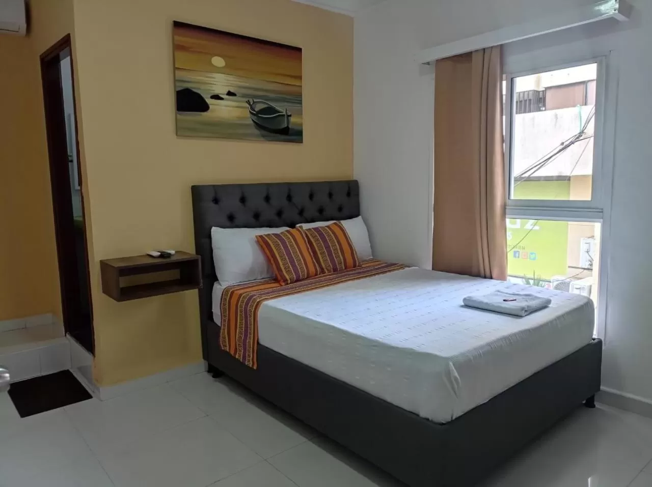 Bed in ANAJIRAWAA HOTEL