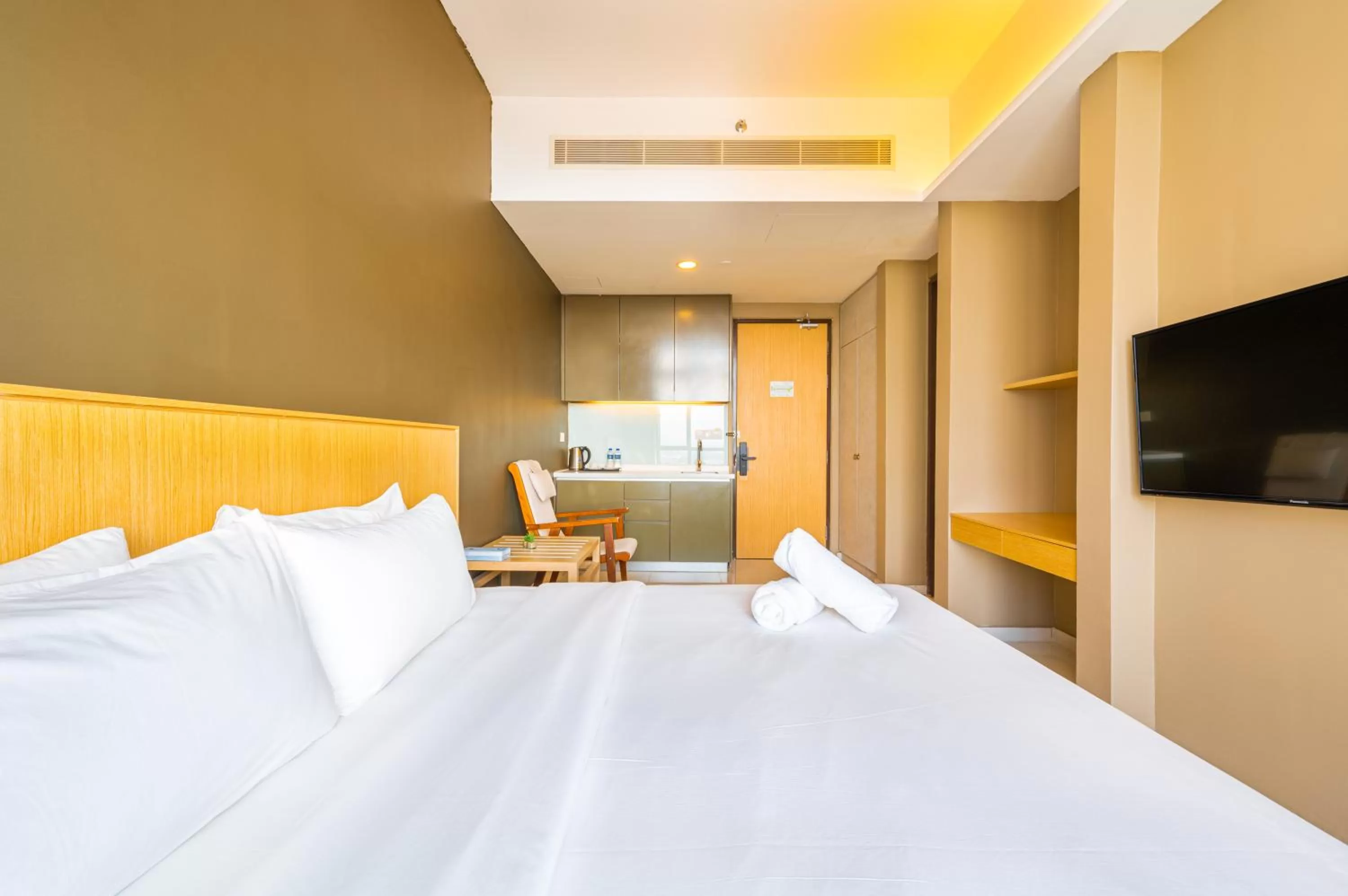 Bed in Greystone 99 Suites