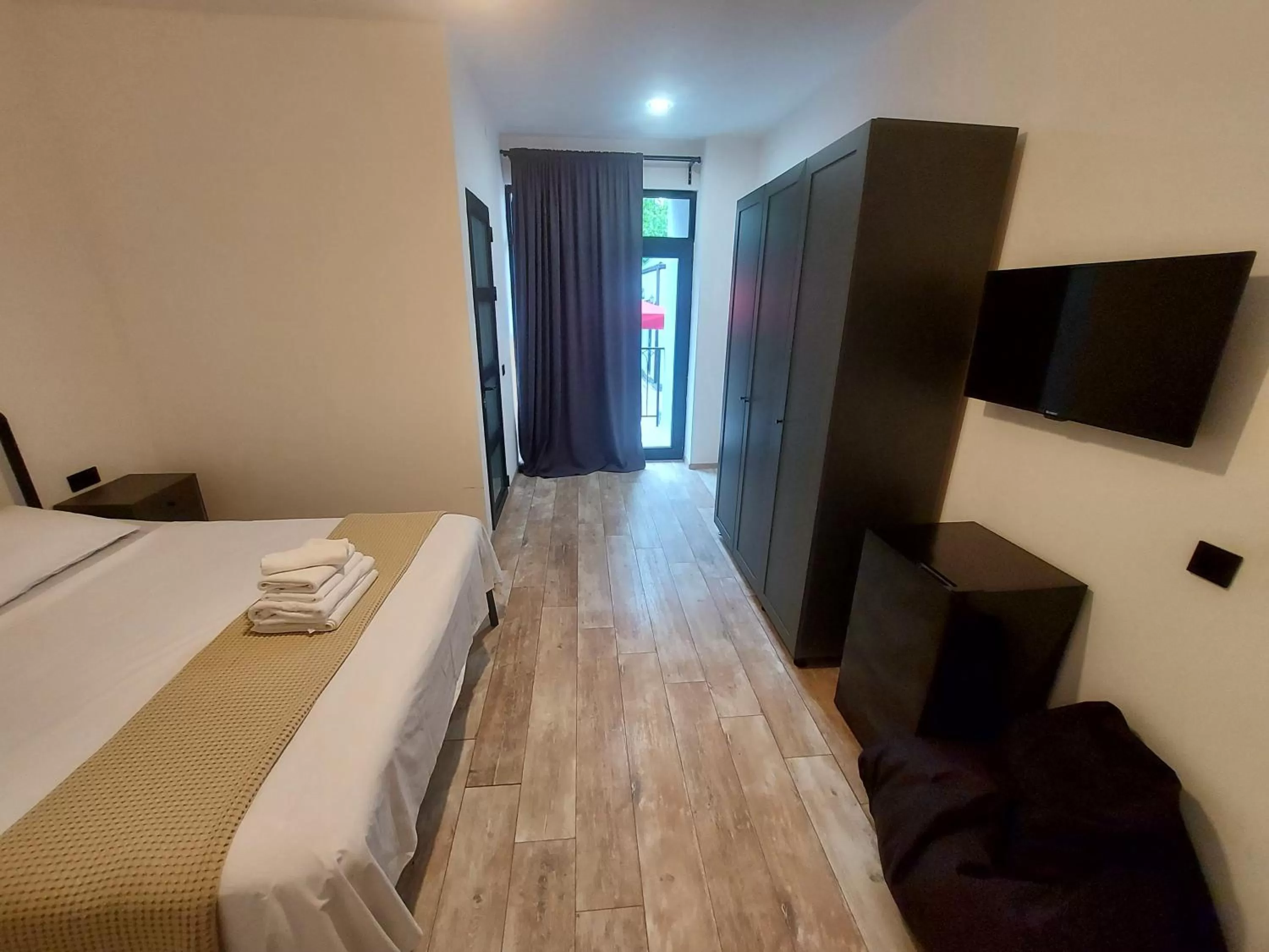 Bedroom, TV/Entertainment Center in Level Up Hotel & Restaurant