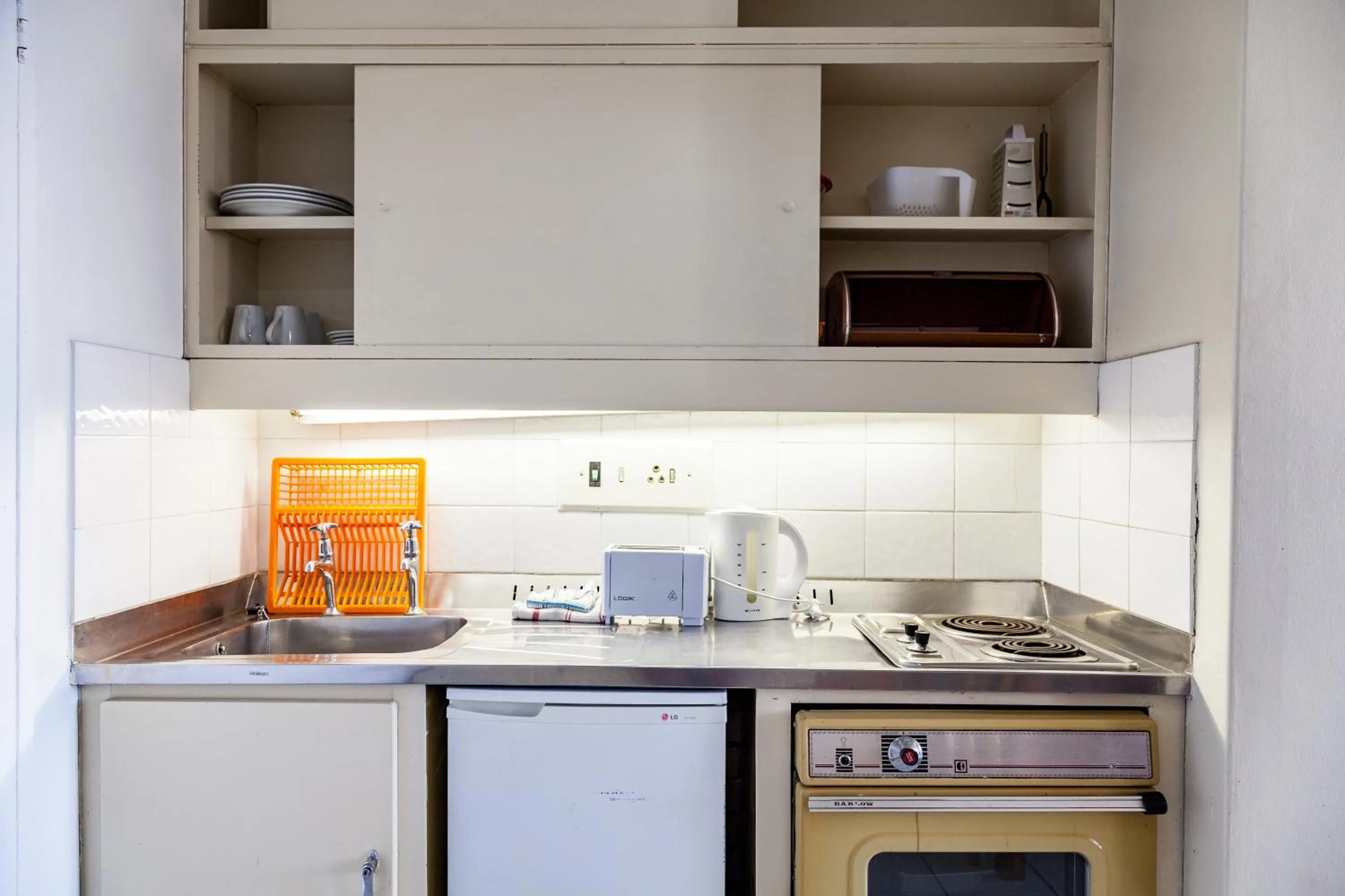Kitchen or kitchenette in Gardens Centre Holiday Apartments