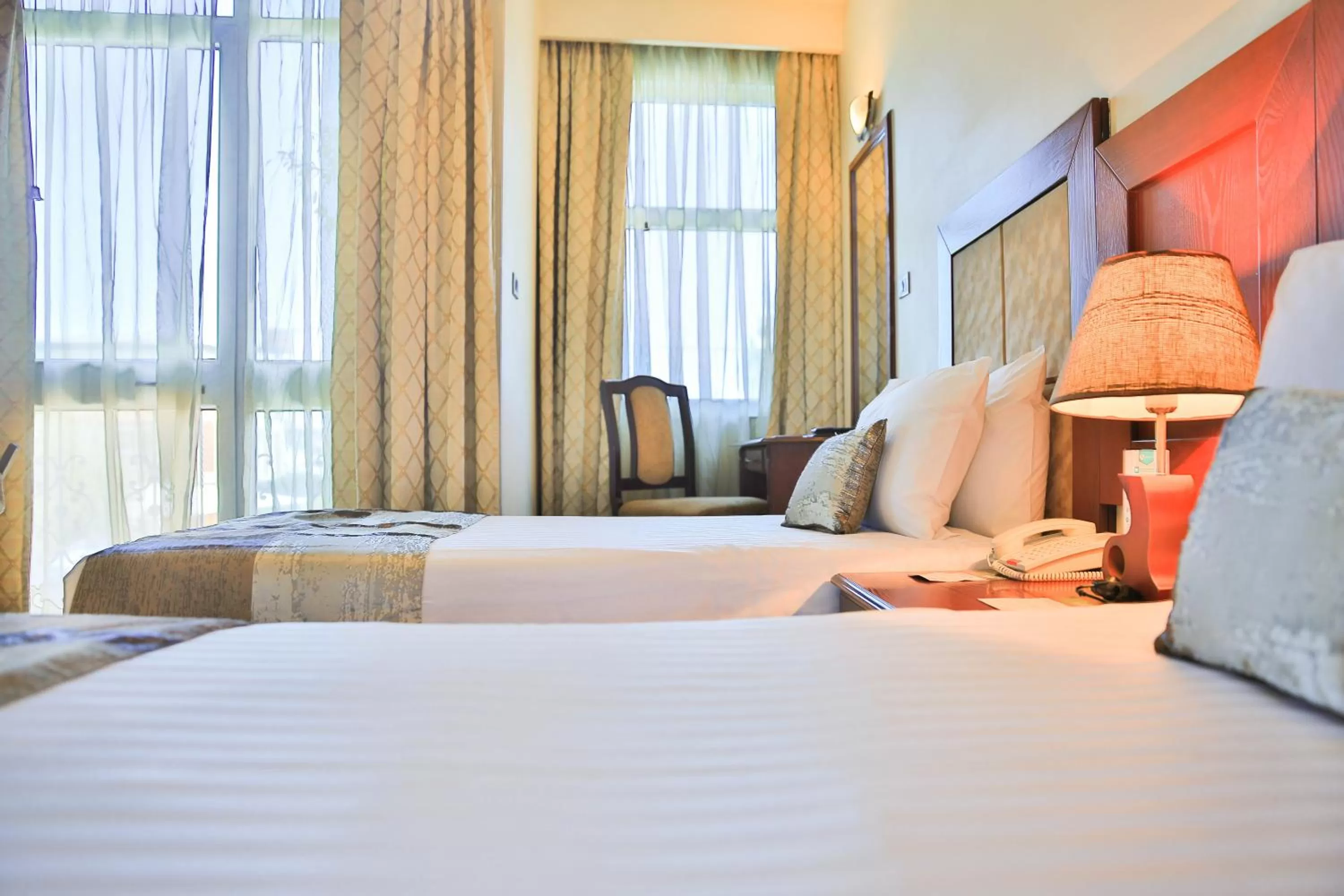 Bed in Swiss Inn Nexus Hotel