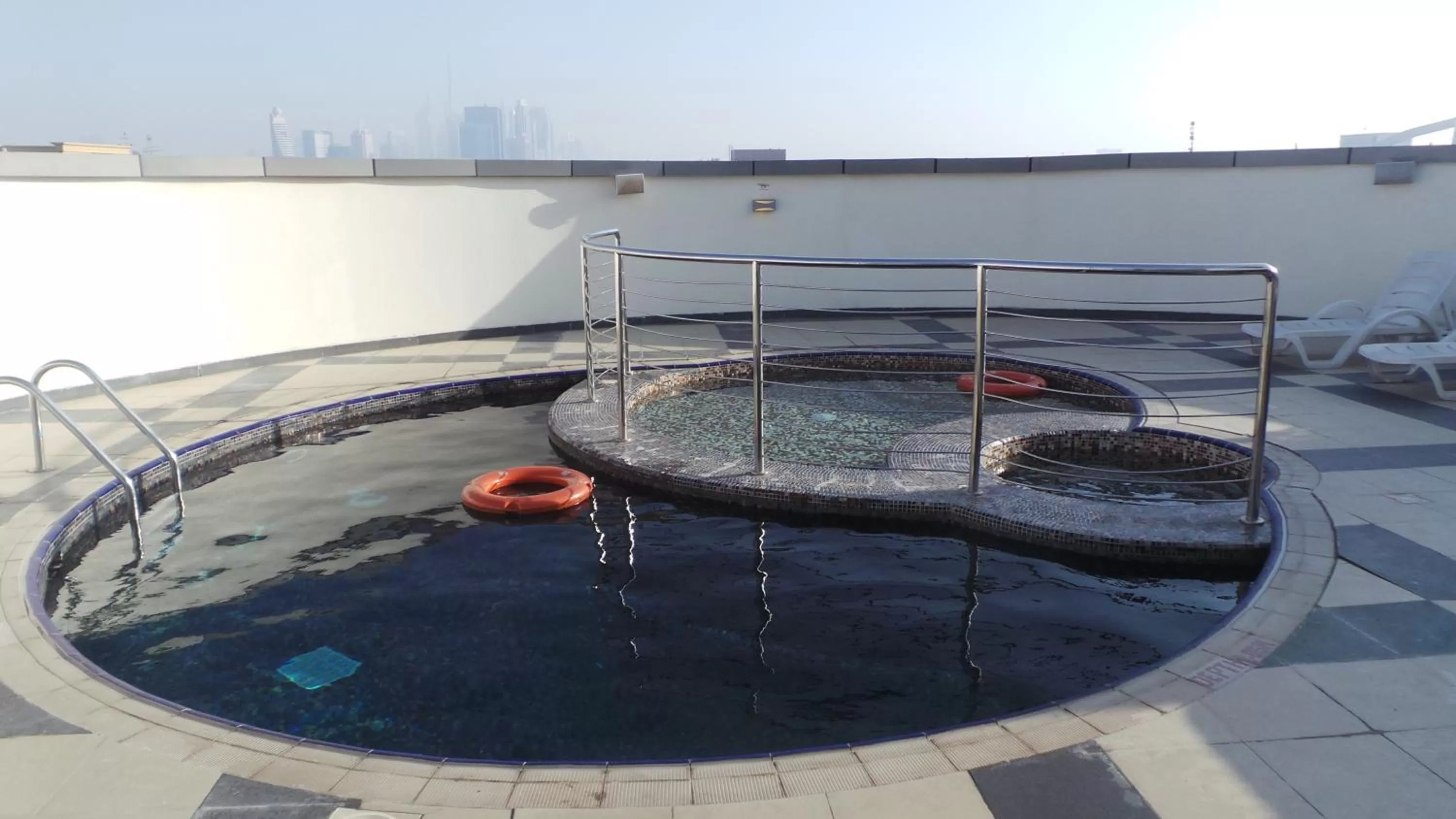 Swimming pool in Xclusive Maples Hotel Apartment