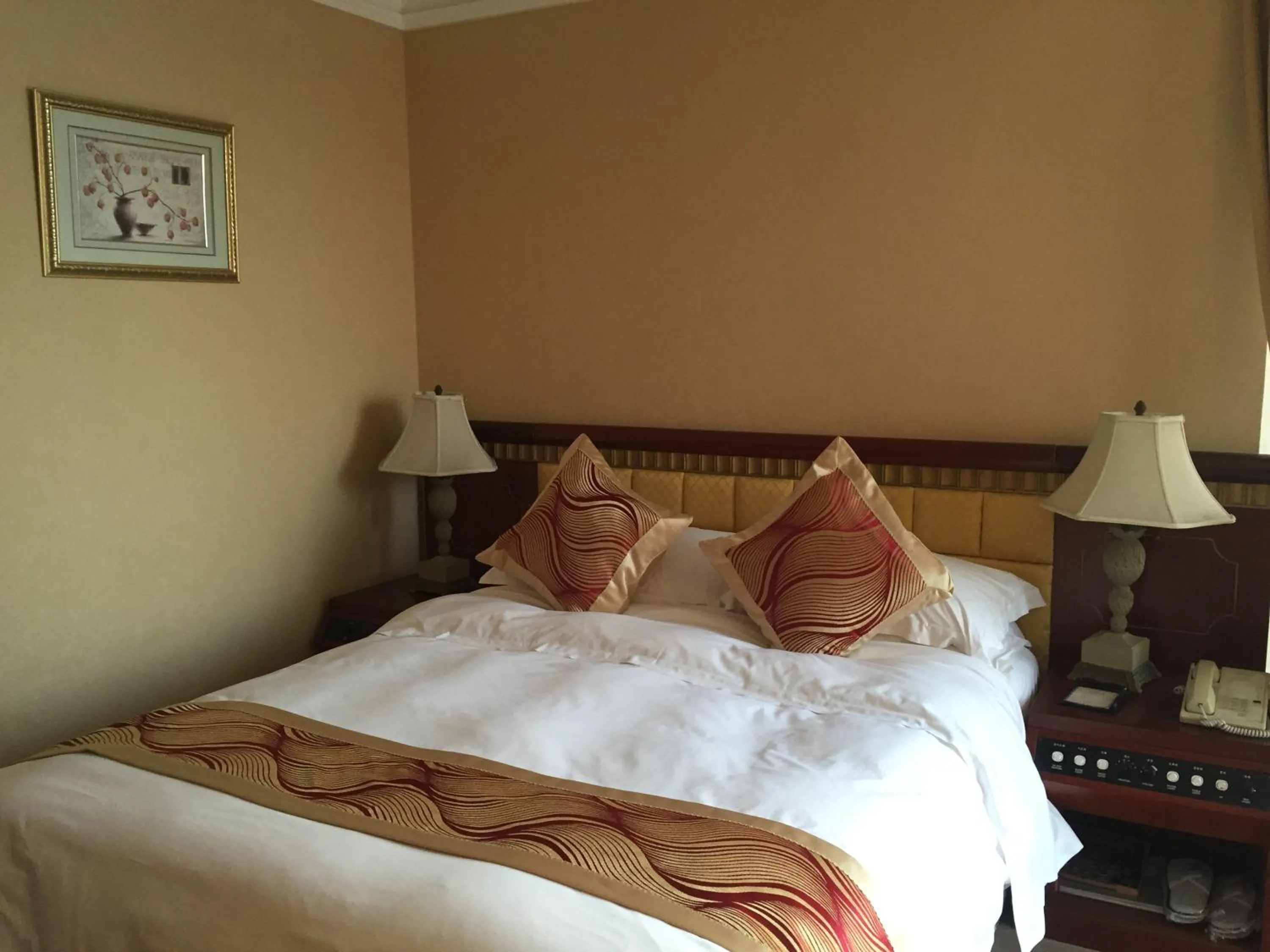 Bed in Huiquan Dynasty Hotel Qingdao