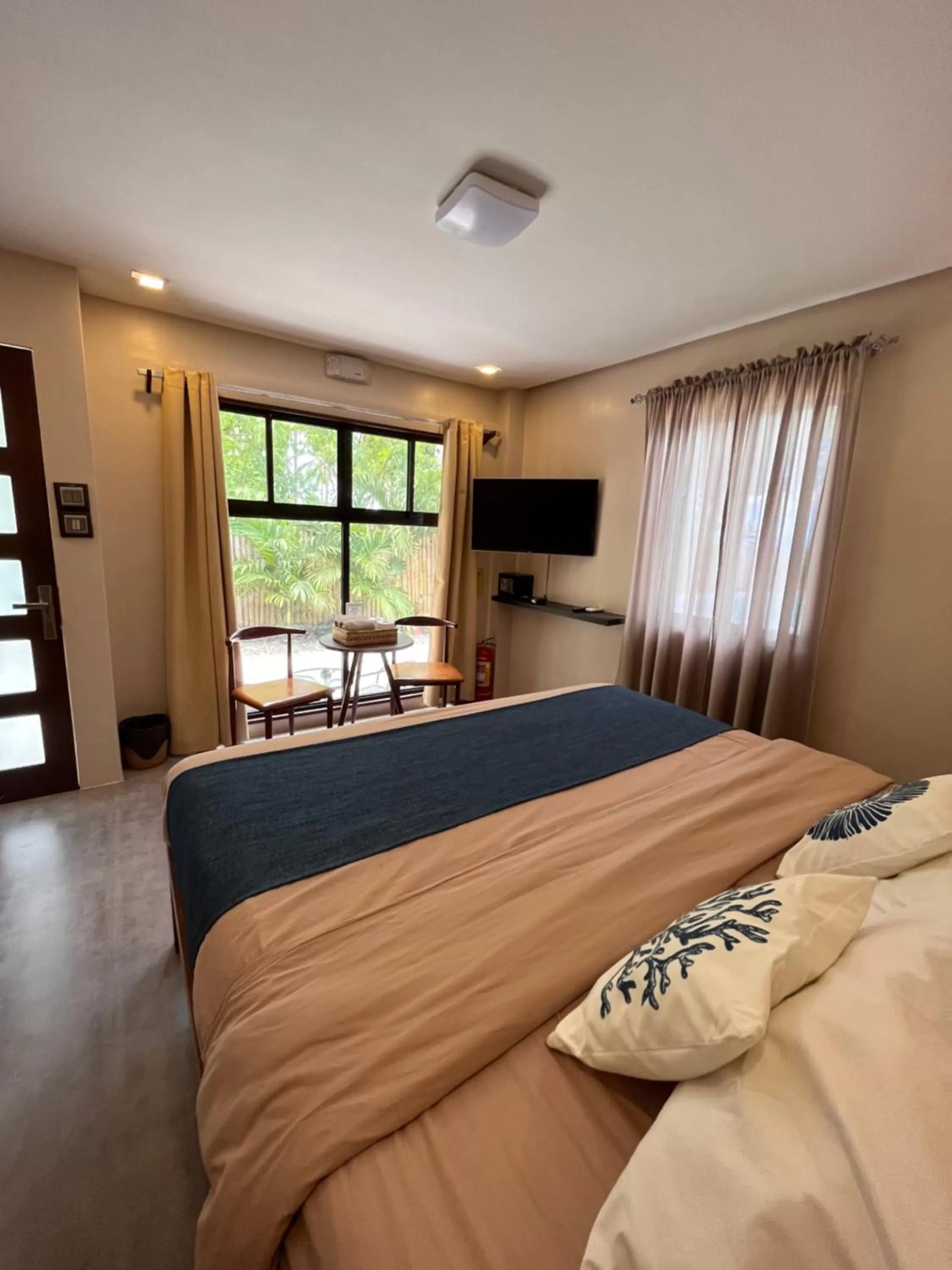 Bed in Southseas Beach Resort and Dive Center