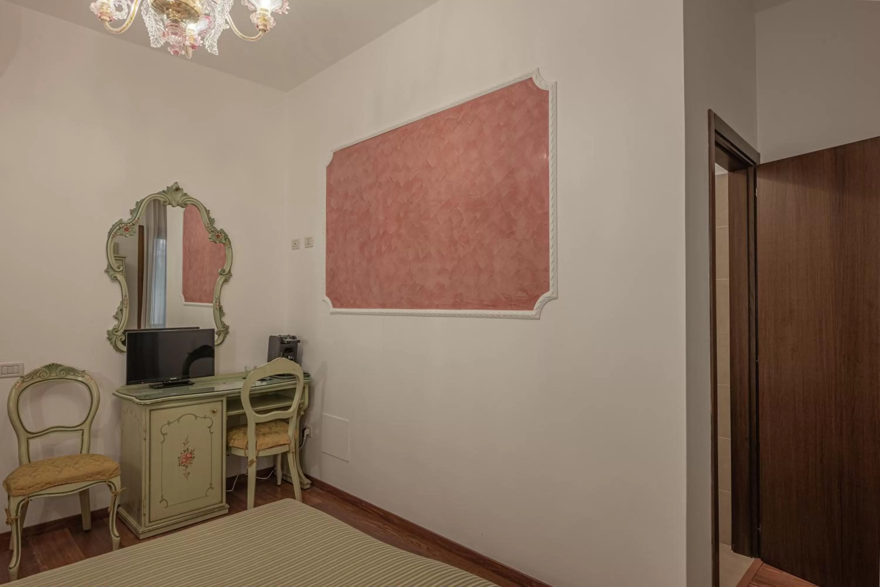 Bedroom in Hotel al Sotoportego