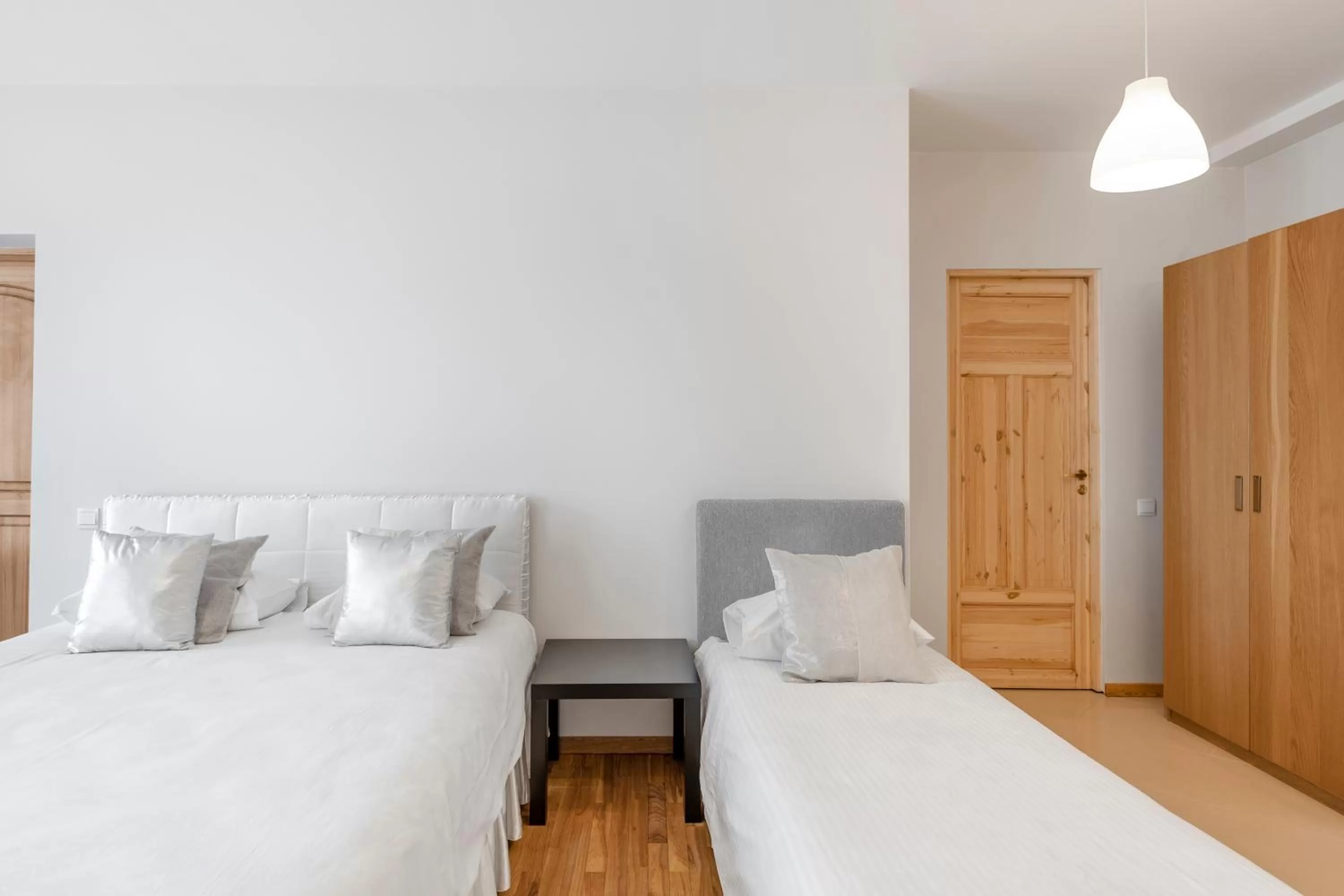 Bed in Vilnius Apartments