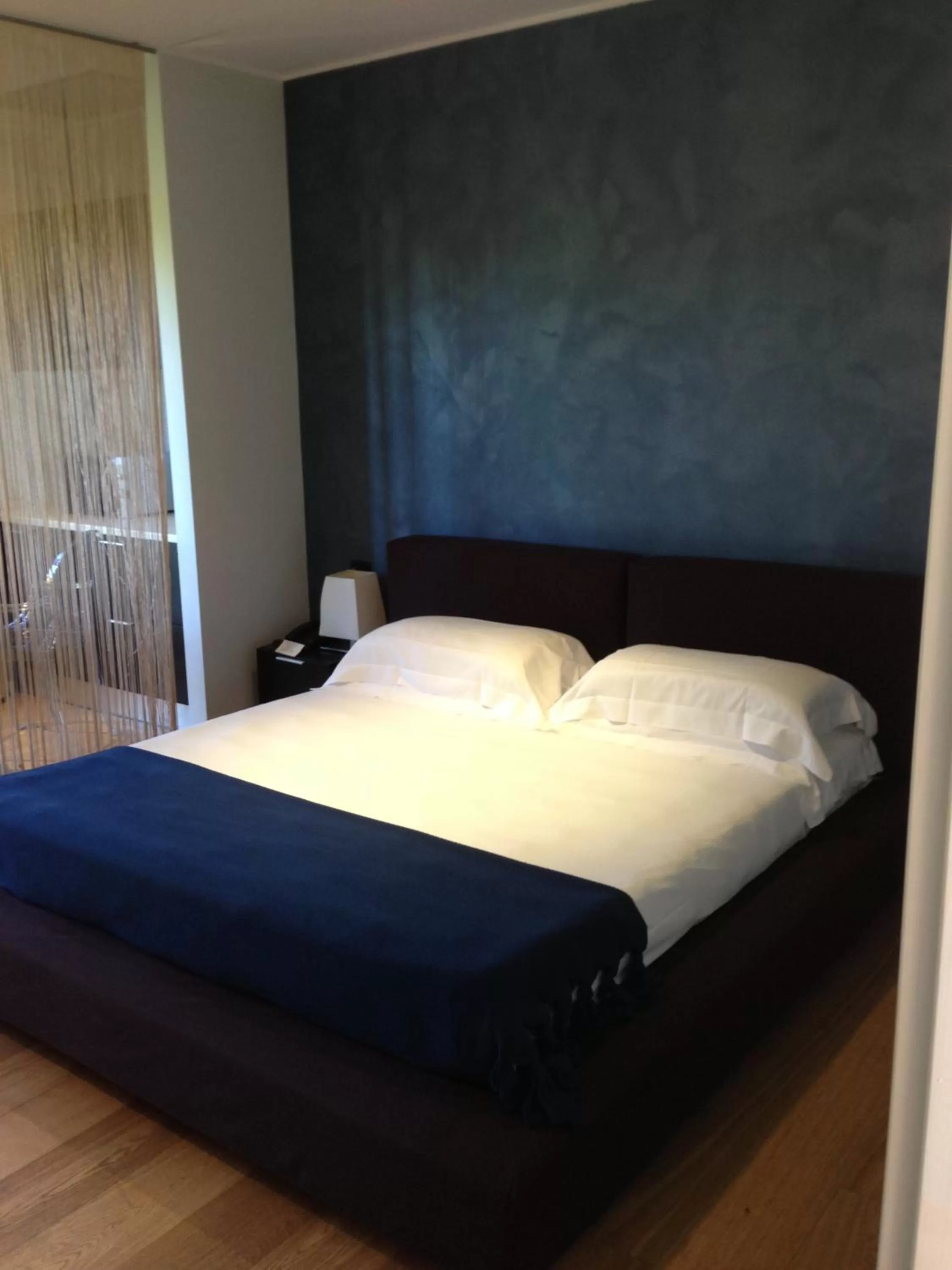 Bed in Joia Hotel & Luxury Apartments RTA