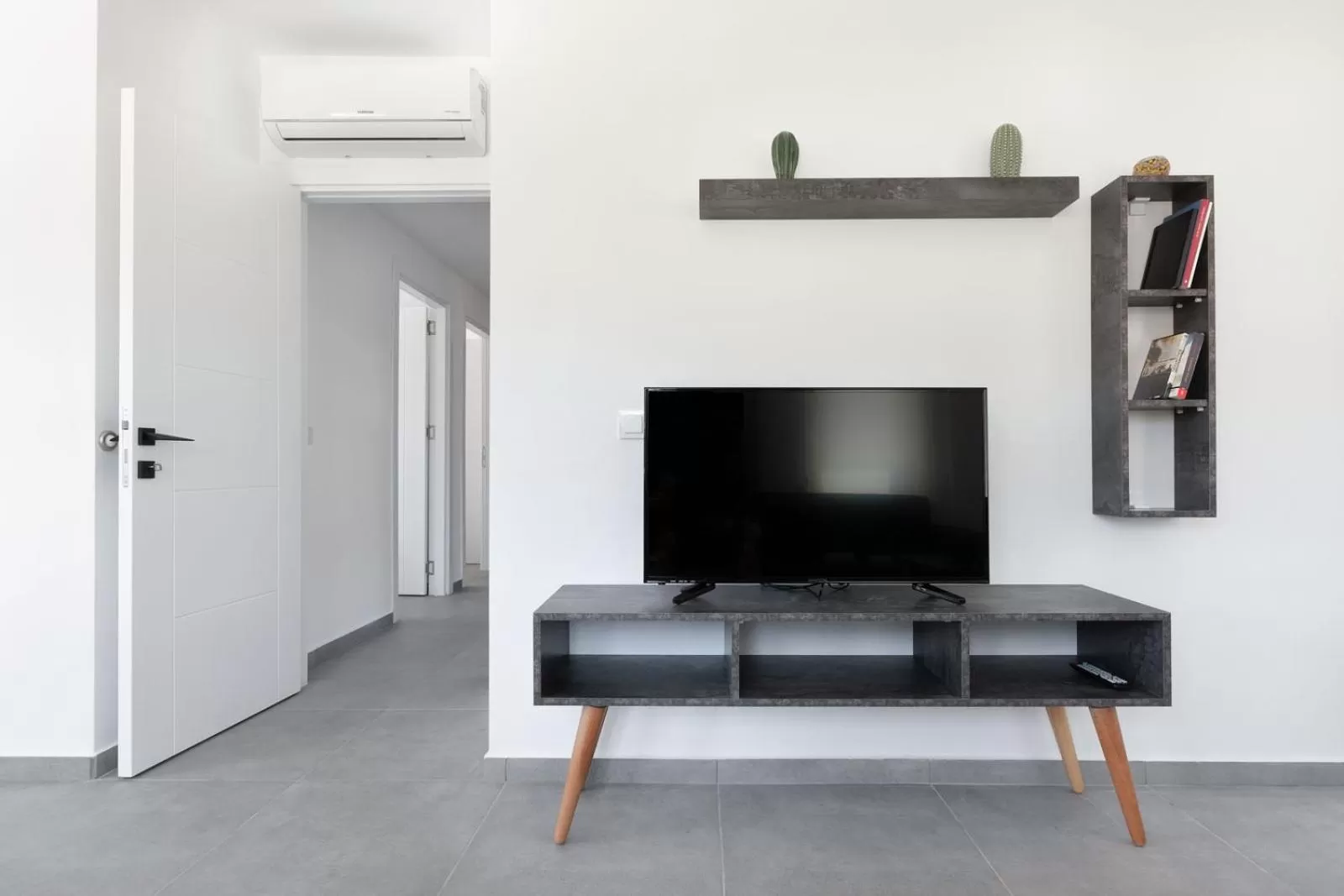 Communal lounge/ TV room in La Moda Aparts