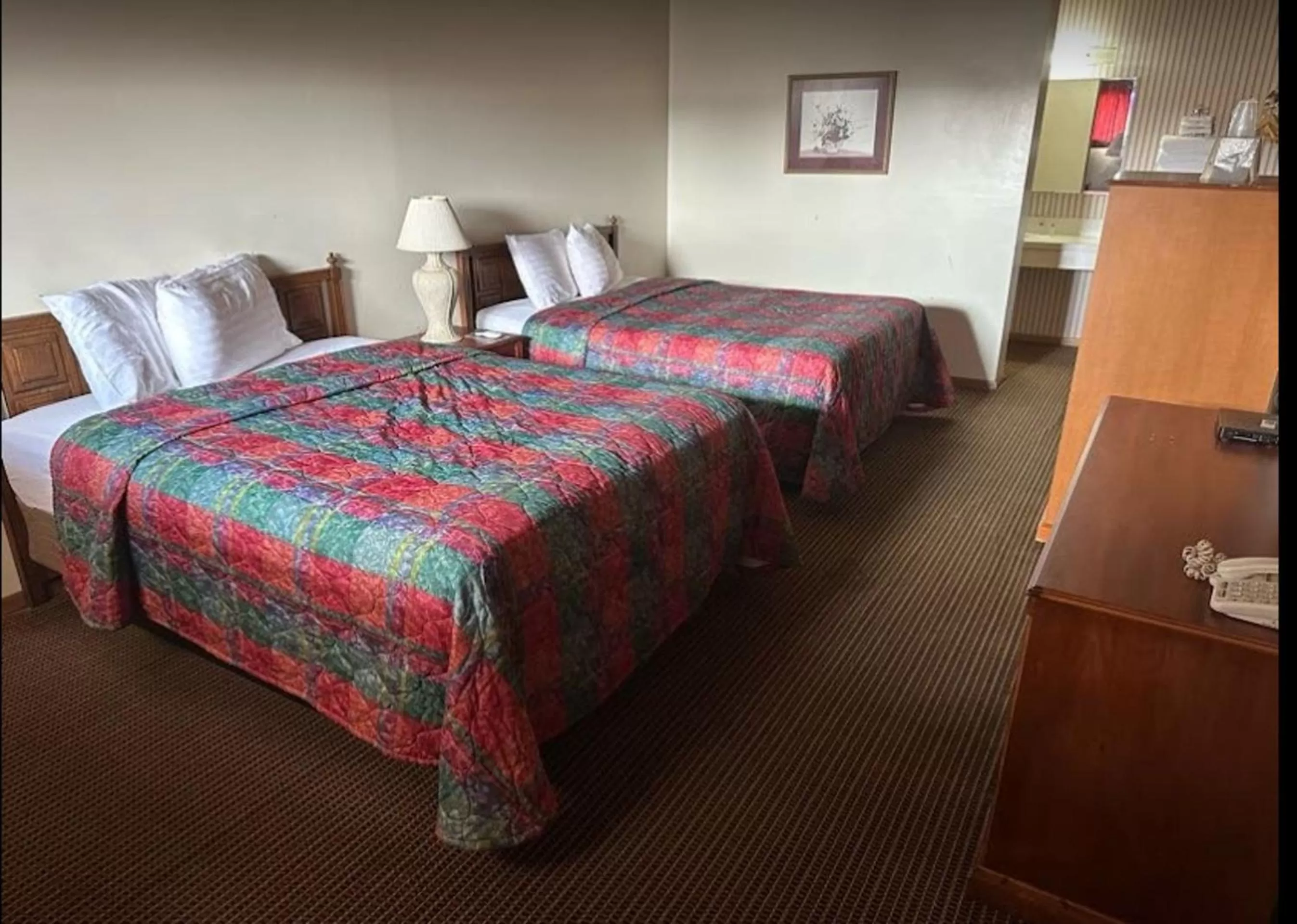 2 Full Bed in Love Hotels Western Holiday by OYO at Harlan Lake NE