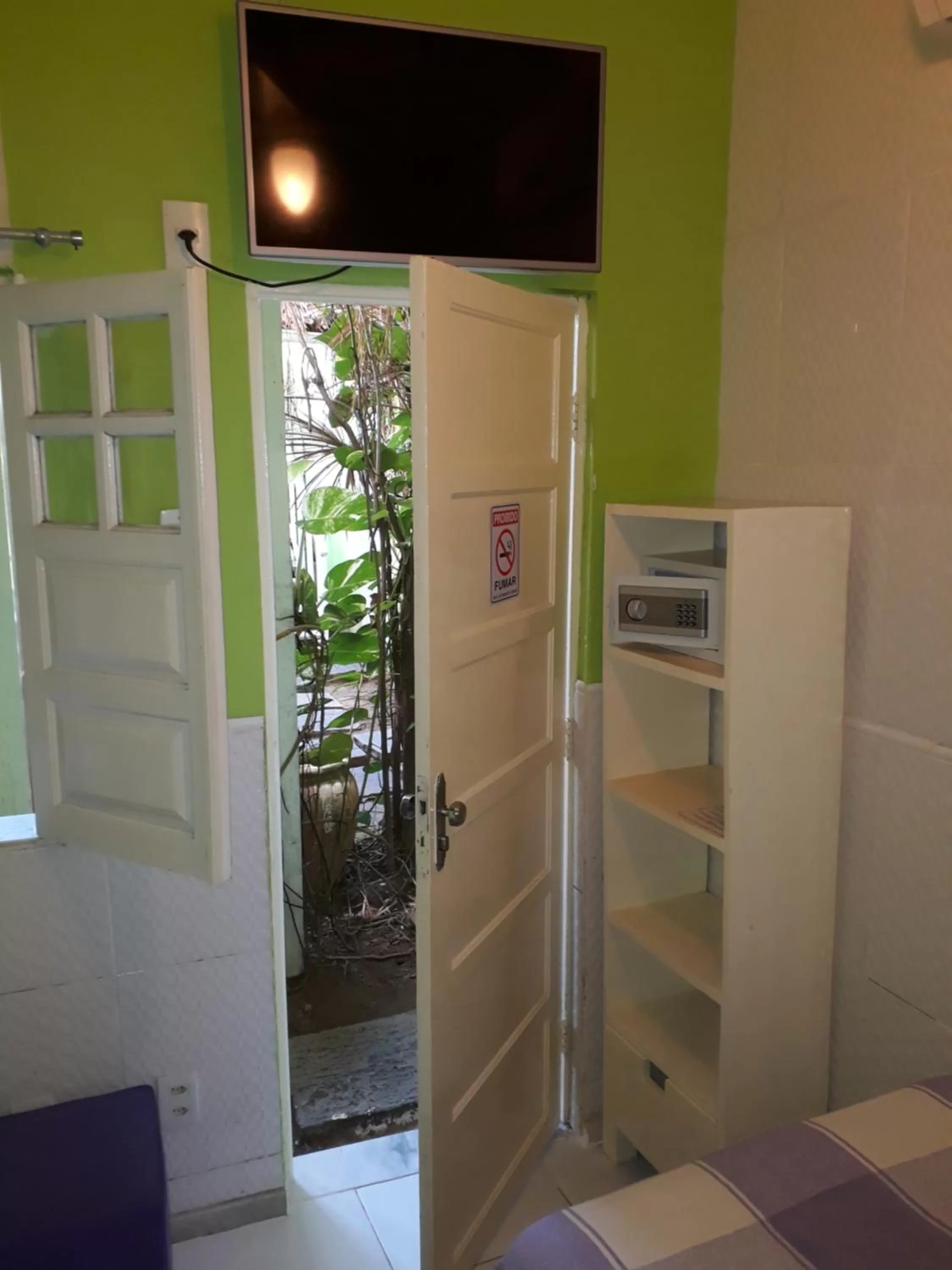 TV/Entertainment Center in Hotel Pousada Papaya Verde