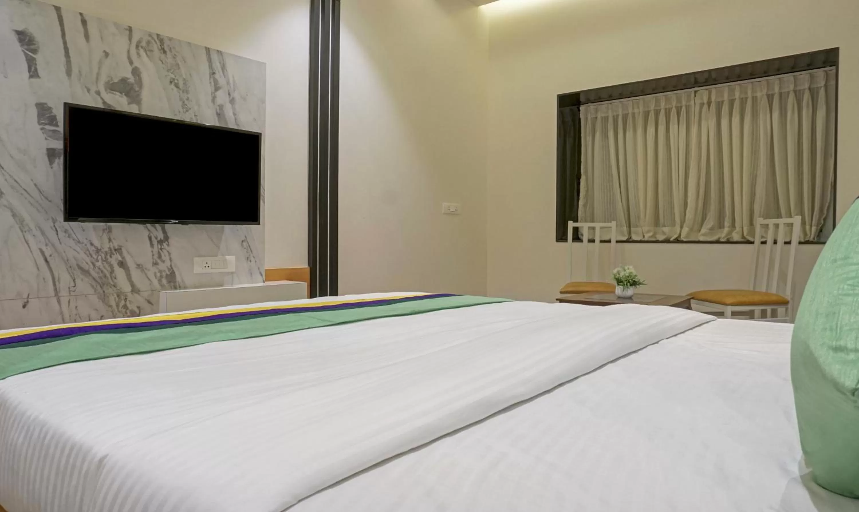 Bedroom, Bed in Treebo The Utsav, Nashik