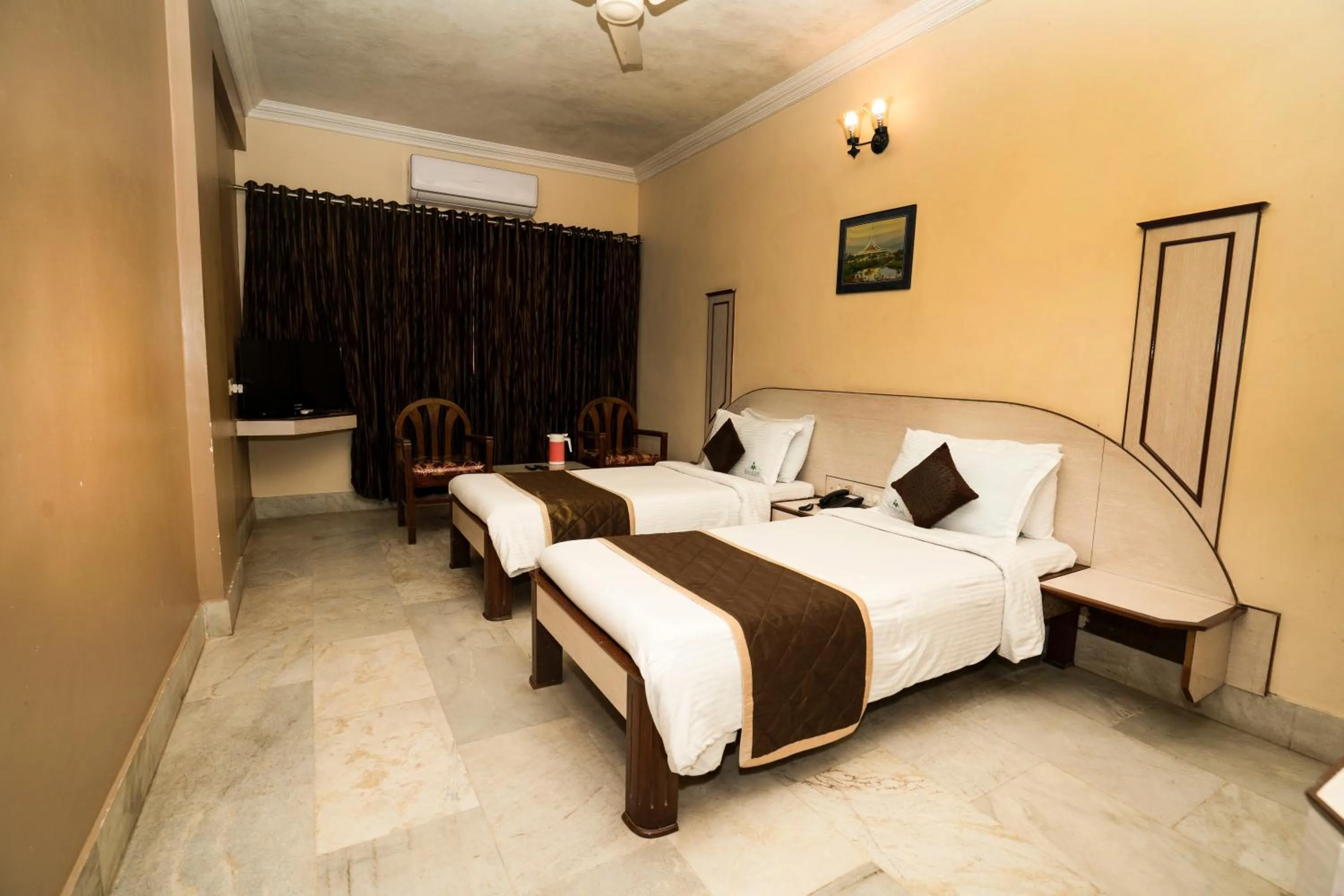 Photo of the whole room, Bed in Hotel Mangalore International