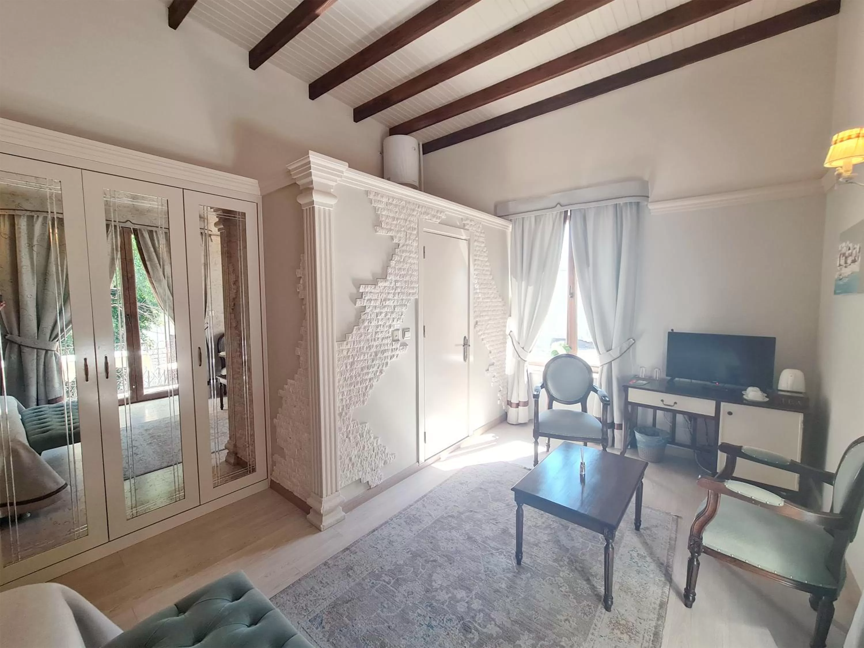 Photo of the whole room, TV/Entertainment Center in SOFIA BOUTIQUE HOTEL