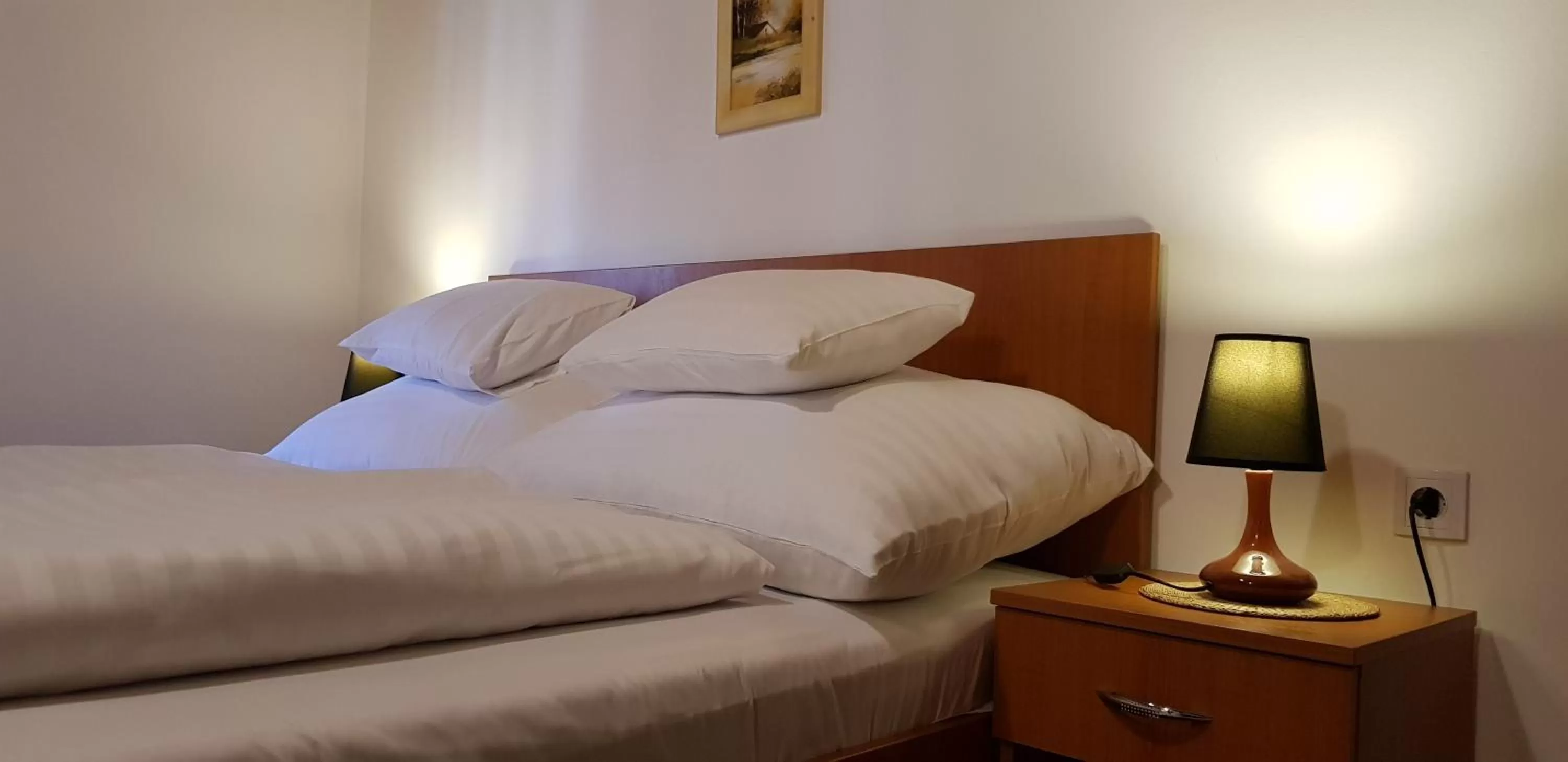 Bed in Central Panzió Gyula