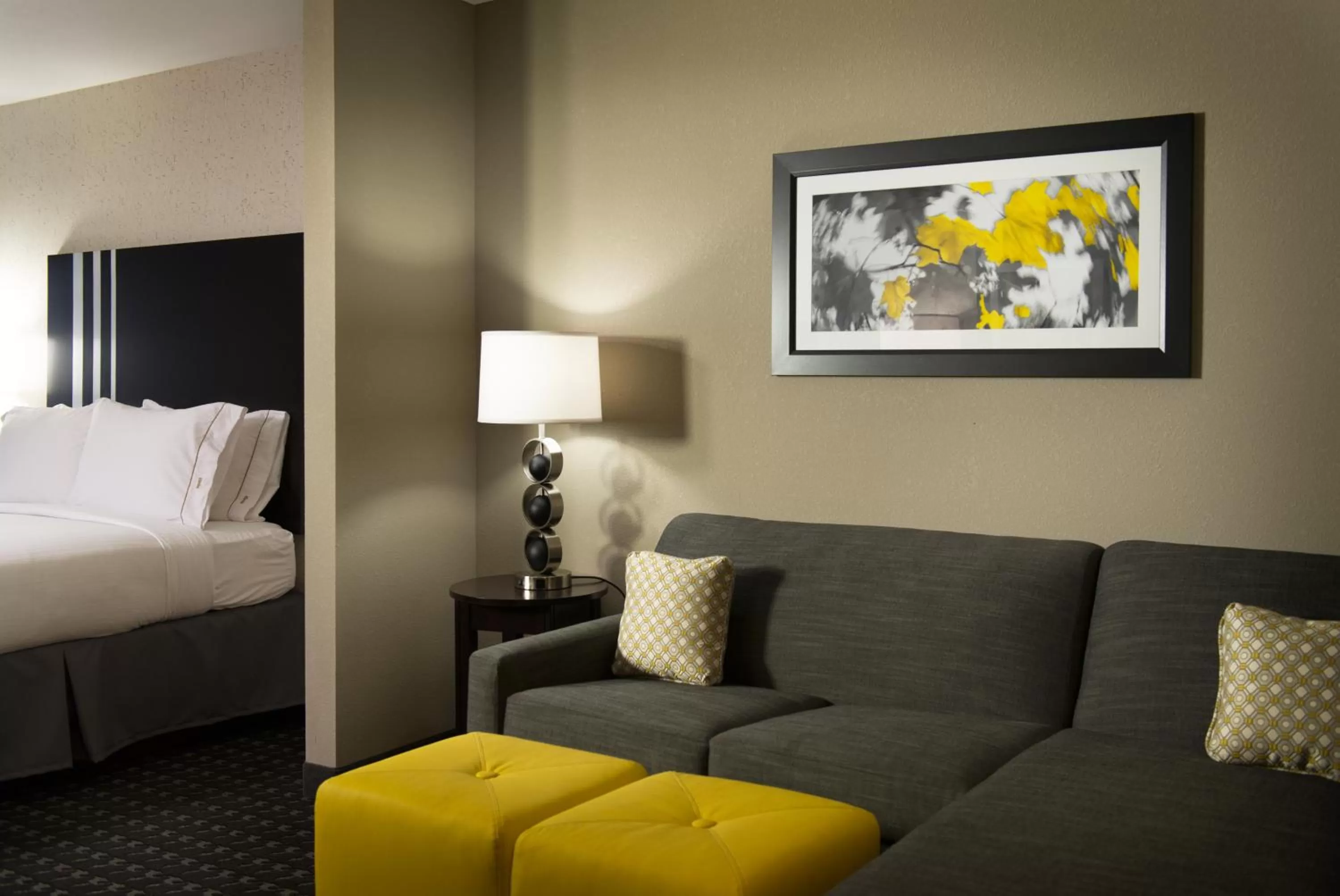 Seating area, Bed in Holiday Inn Express and Suites Madison Central by IHG