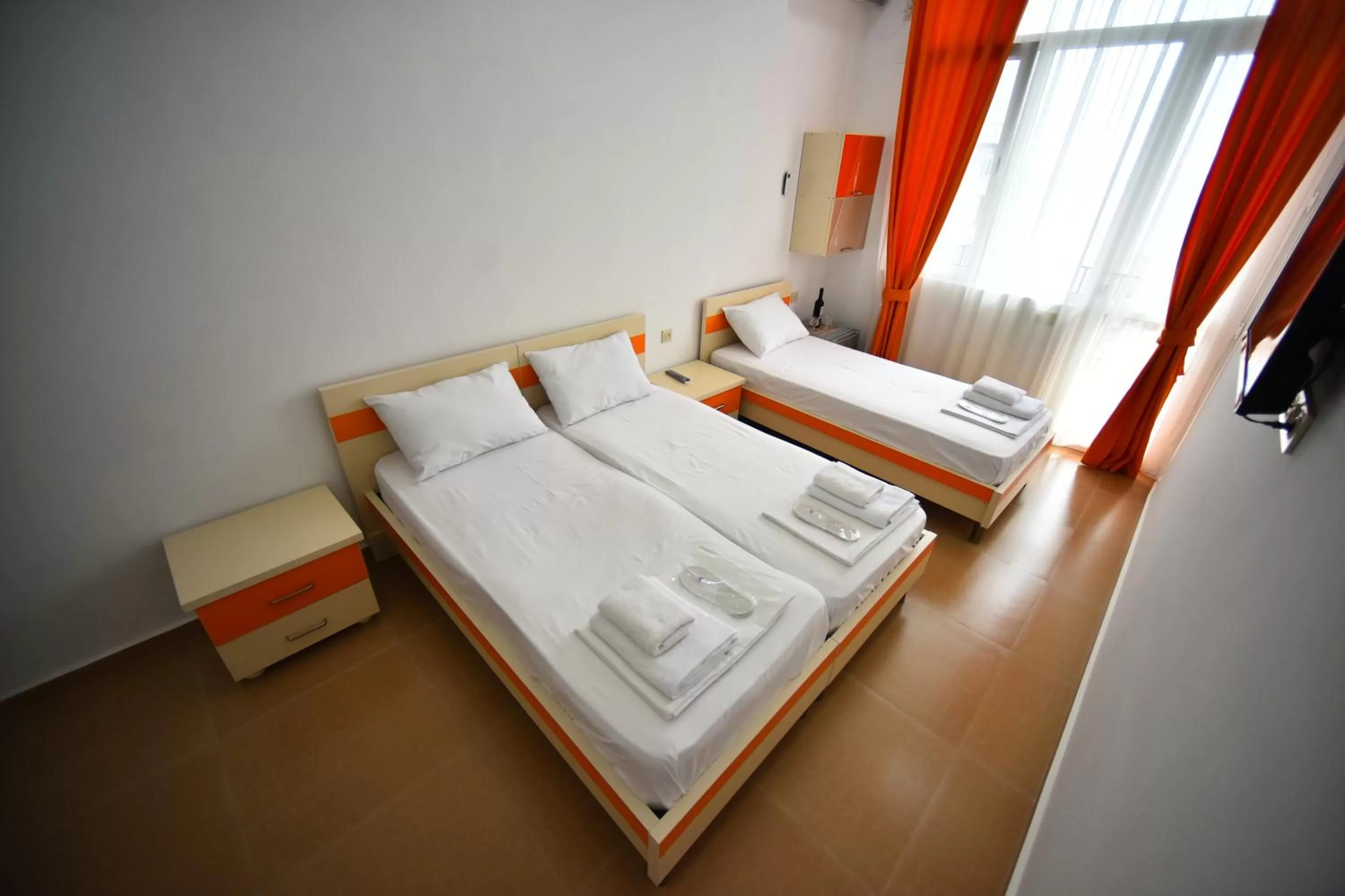 Bed in Orange Home Hotel
