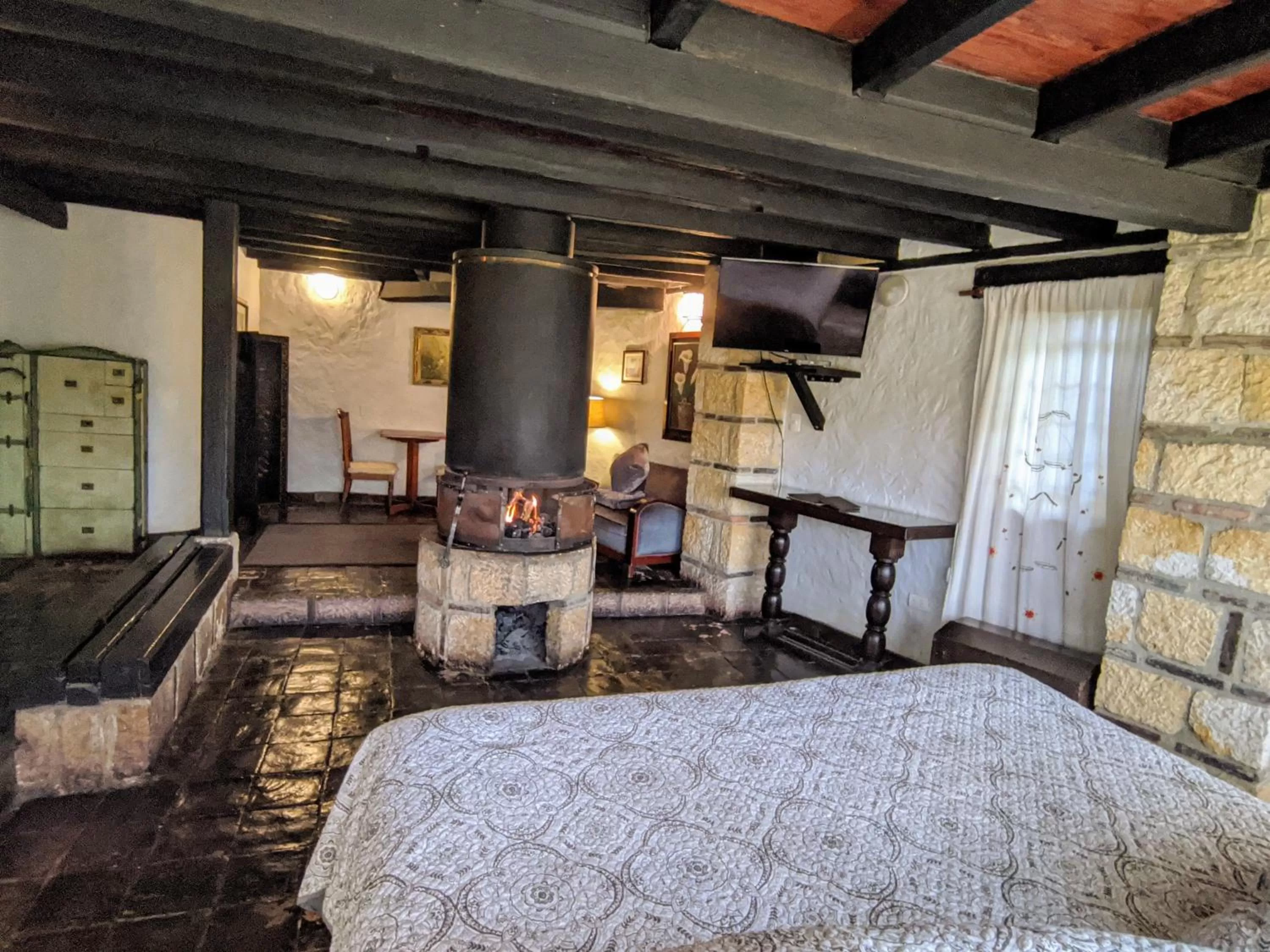 Bed, Seating Area in Posada Cafe La Huerta