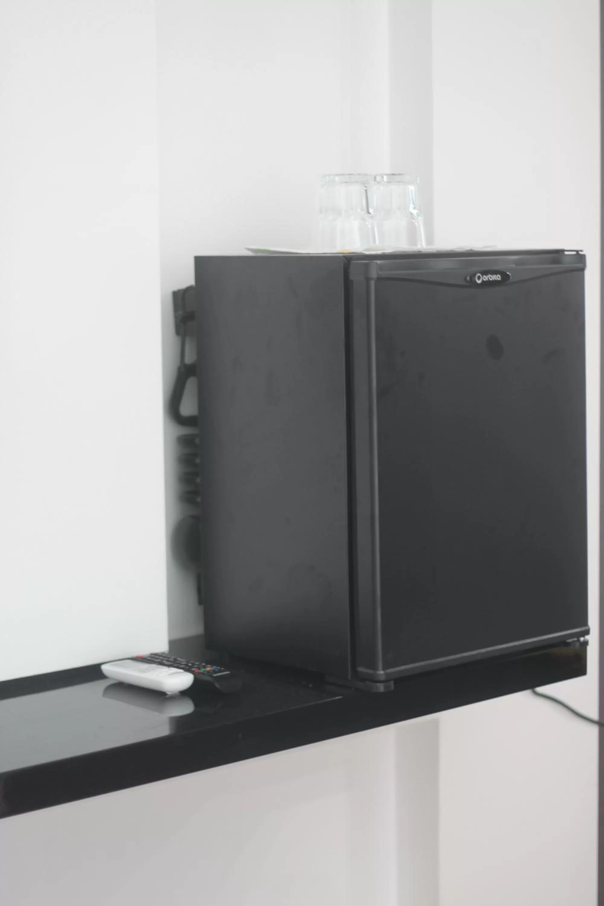 Bedroom, TV/Entertainment Center in Benny's City Hotel