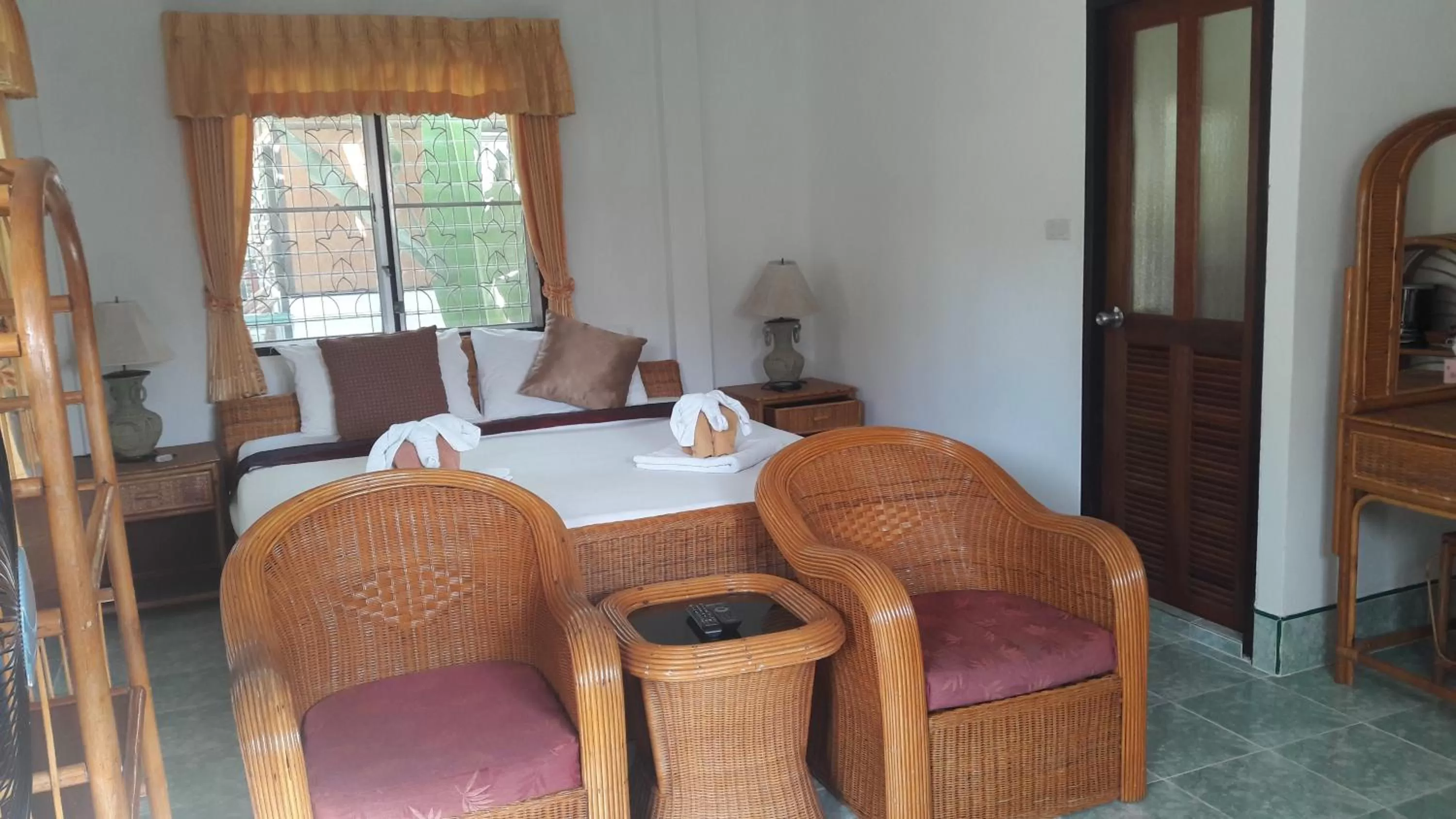 Bed in Jungle Village Bungalow