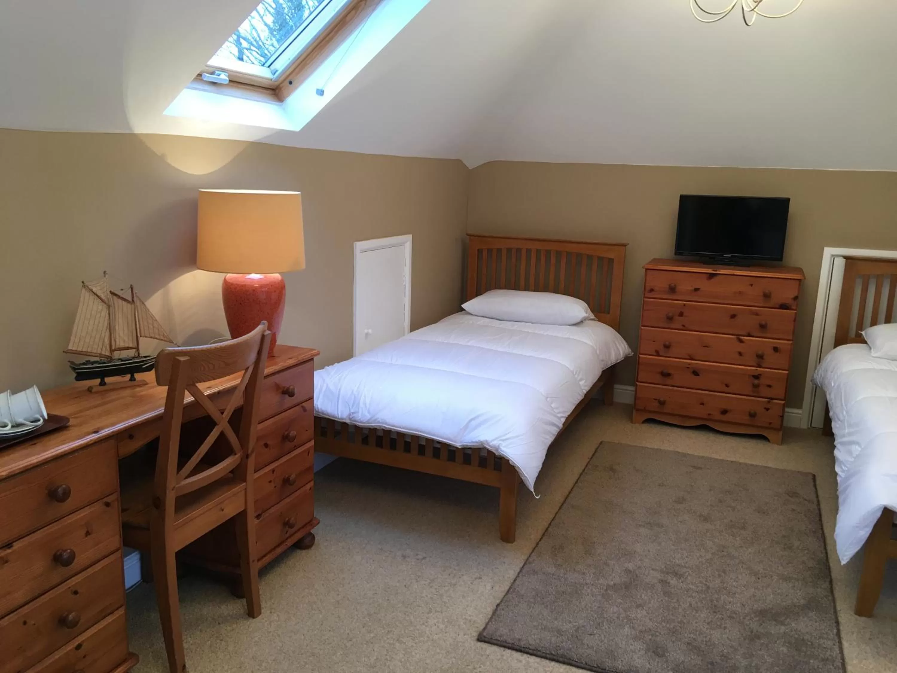 Bed in TRETHEWEY GUEST HOUSE