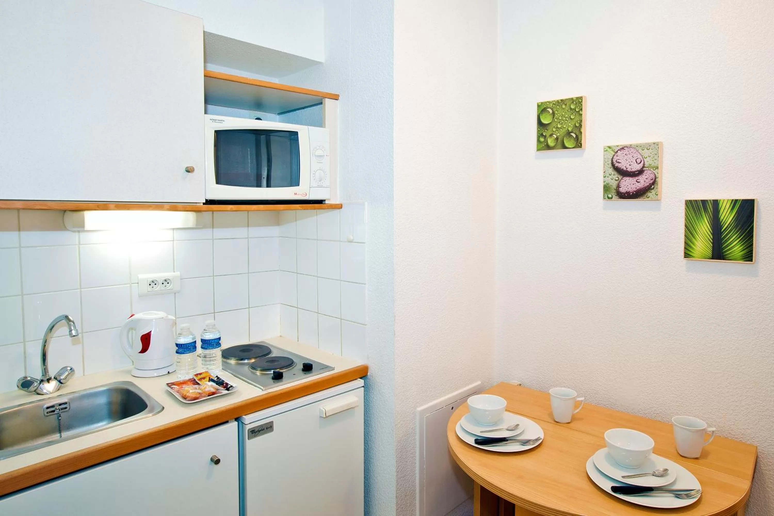 Kitchen or kitchenette in Séjours & Affaires Rennes de Bretagne