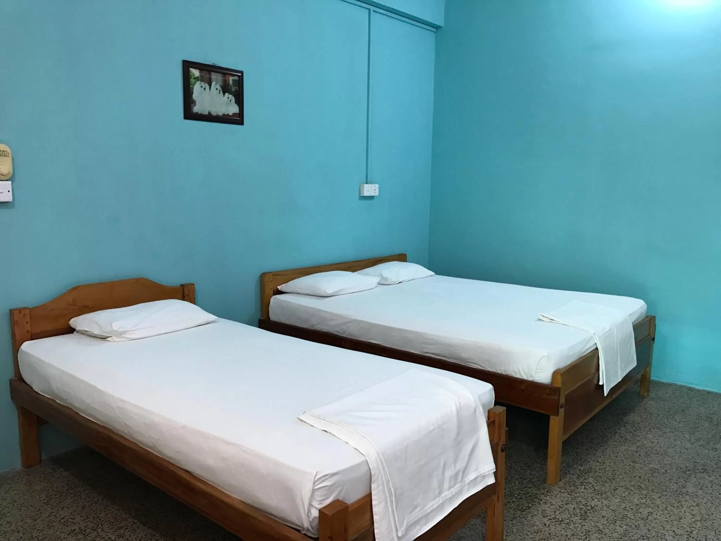 Bed in Gnaanams Hotel and Restaurant