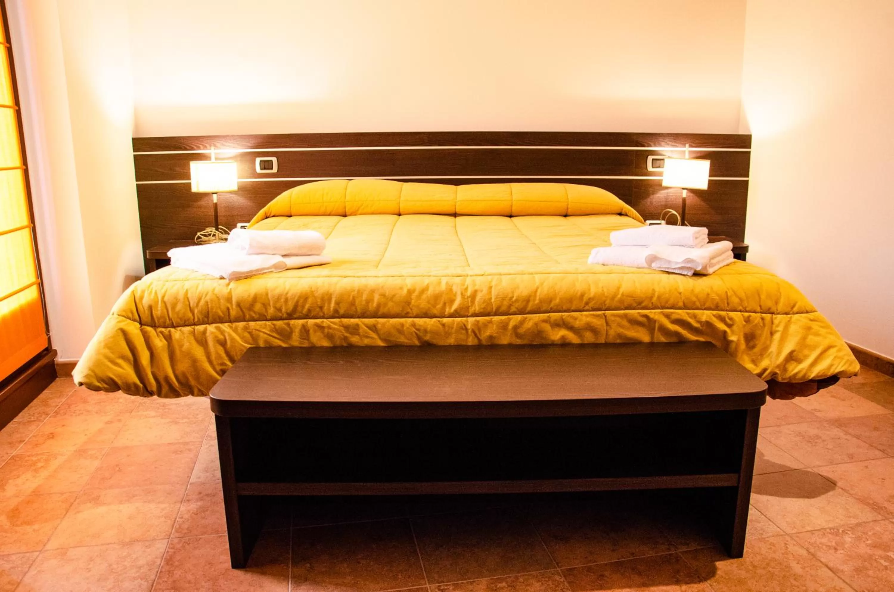 Bed in Al Fogolâr Rooms & Osteria with Saunaland