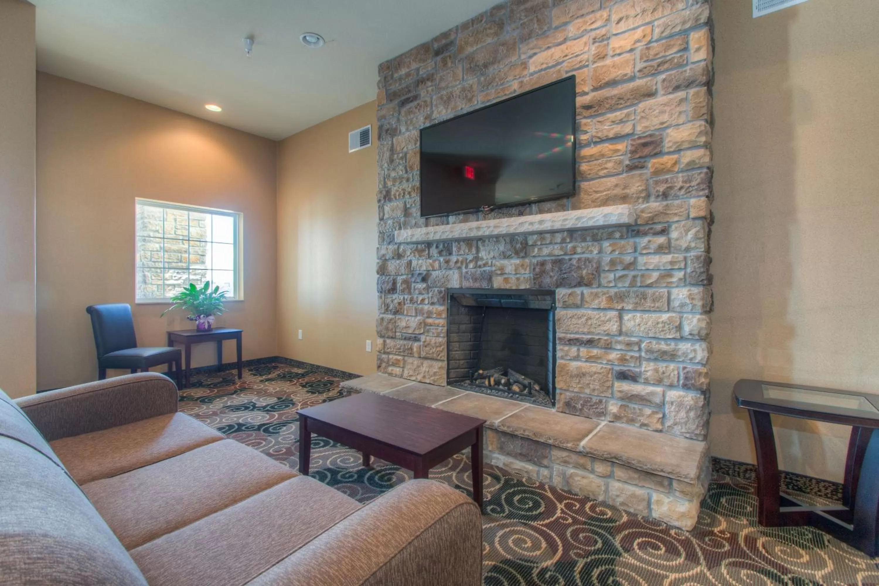 Communal lounge/ TV room in Cobblestone Inn & Suites - Wray