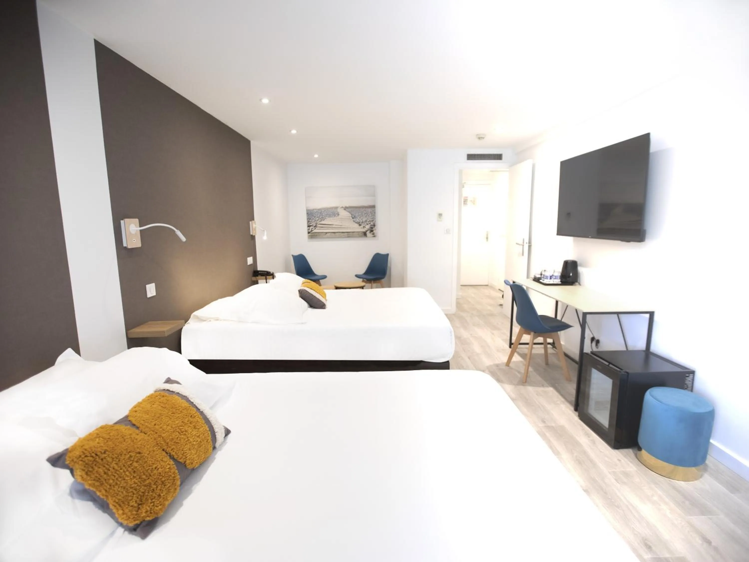 Bed in Tiercé Hotel