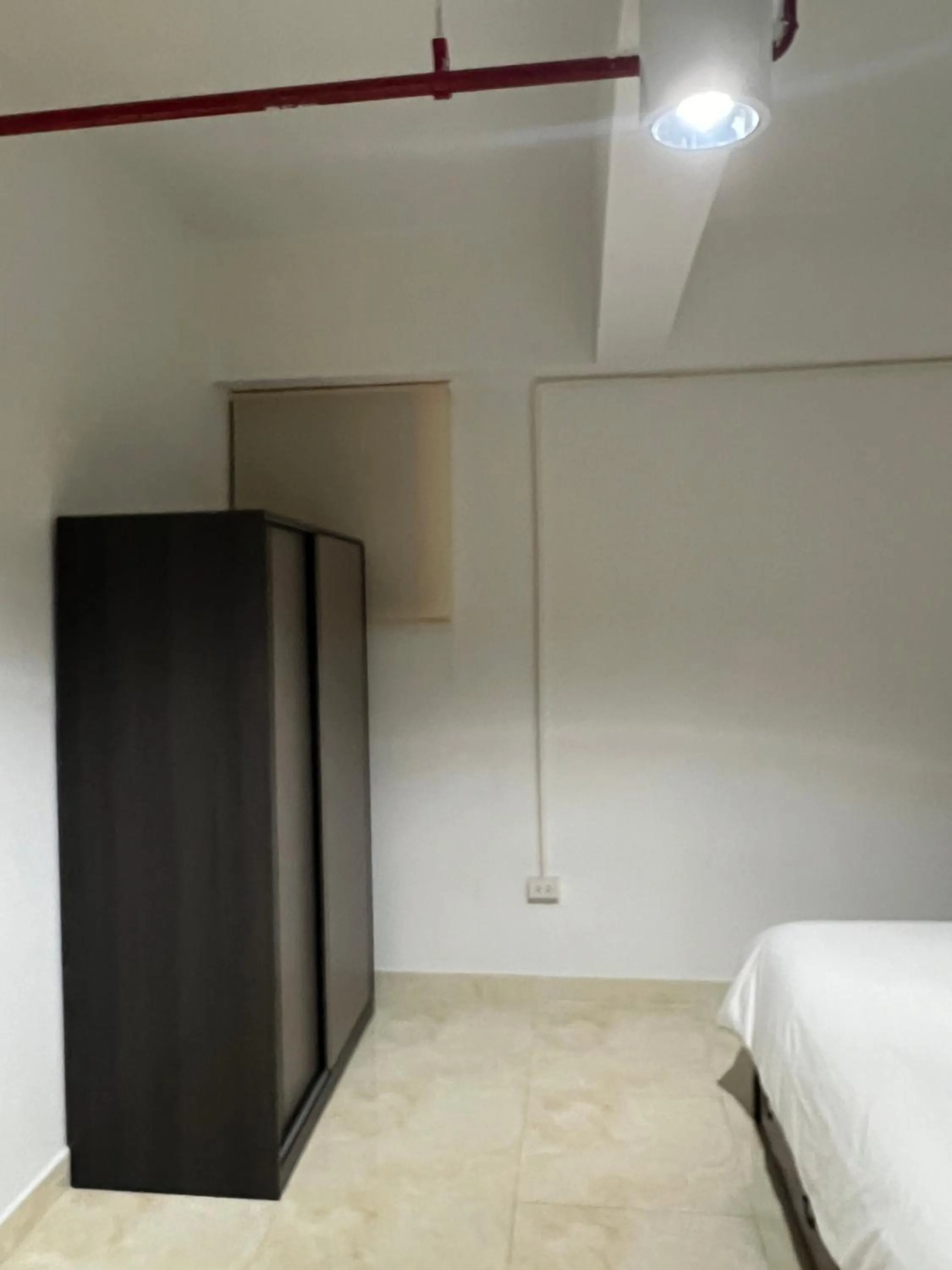 Bed in Mall Suites Hotel