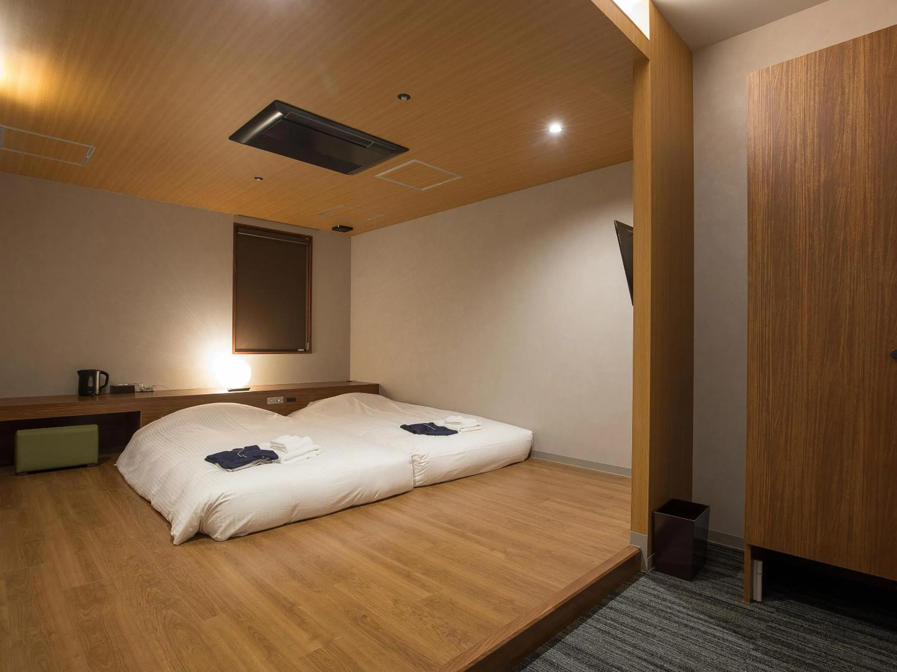 Bed in Gardens Cabin