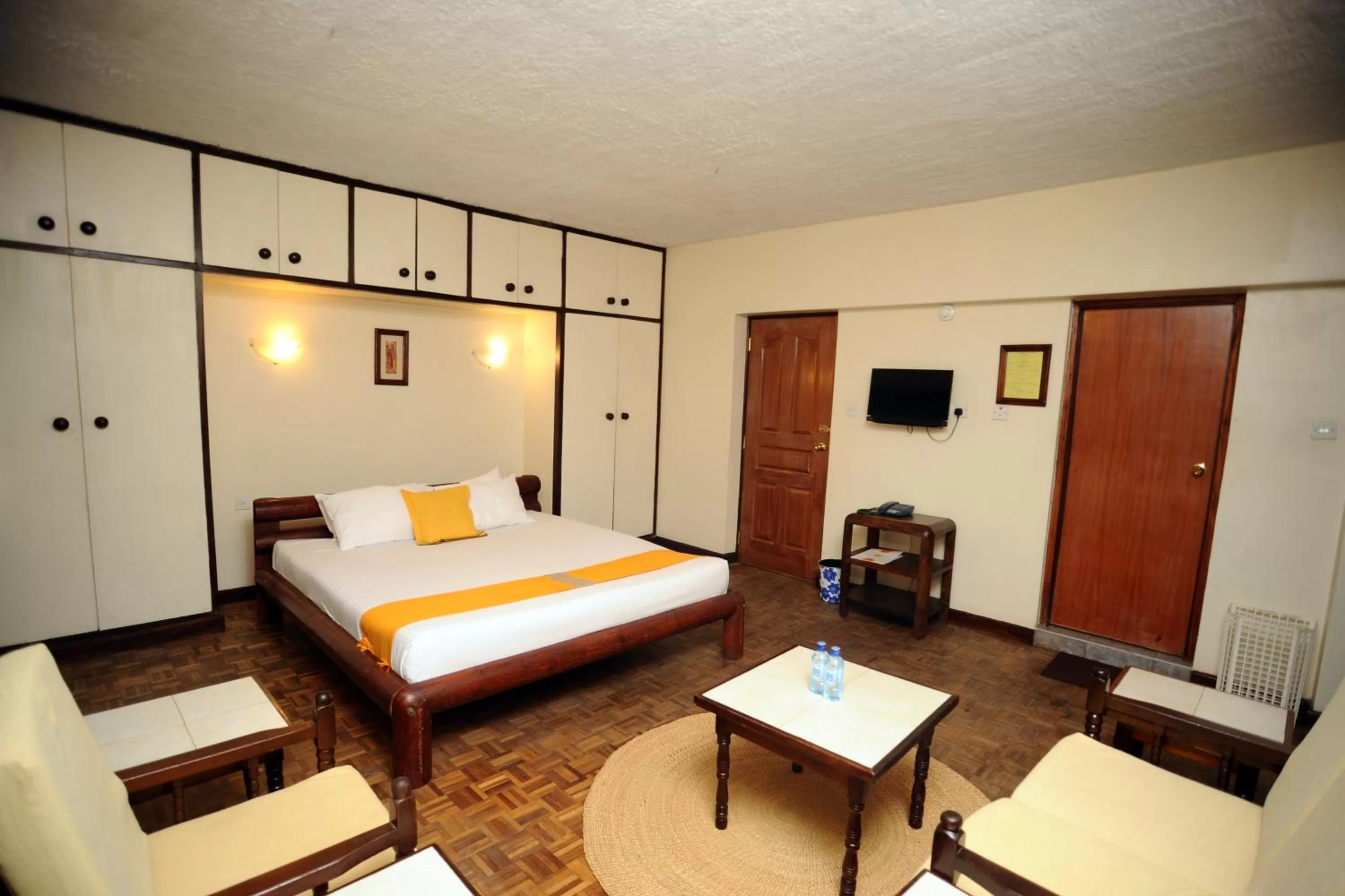 Communal lounge/ TV room, Bed in Kenya Comfort Suites