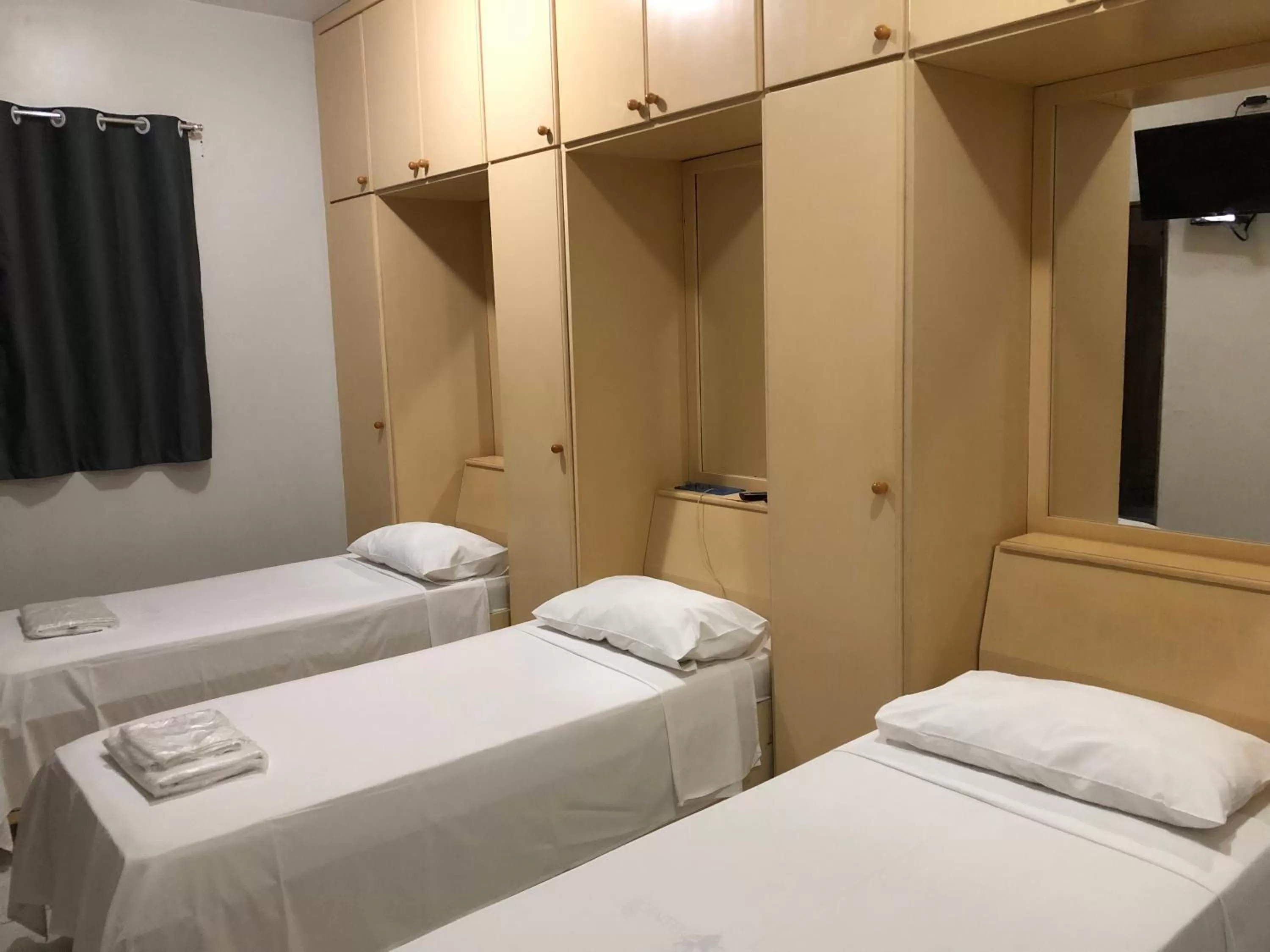 Bed in Center Plaza Hotel