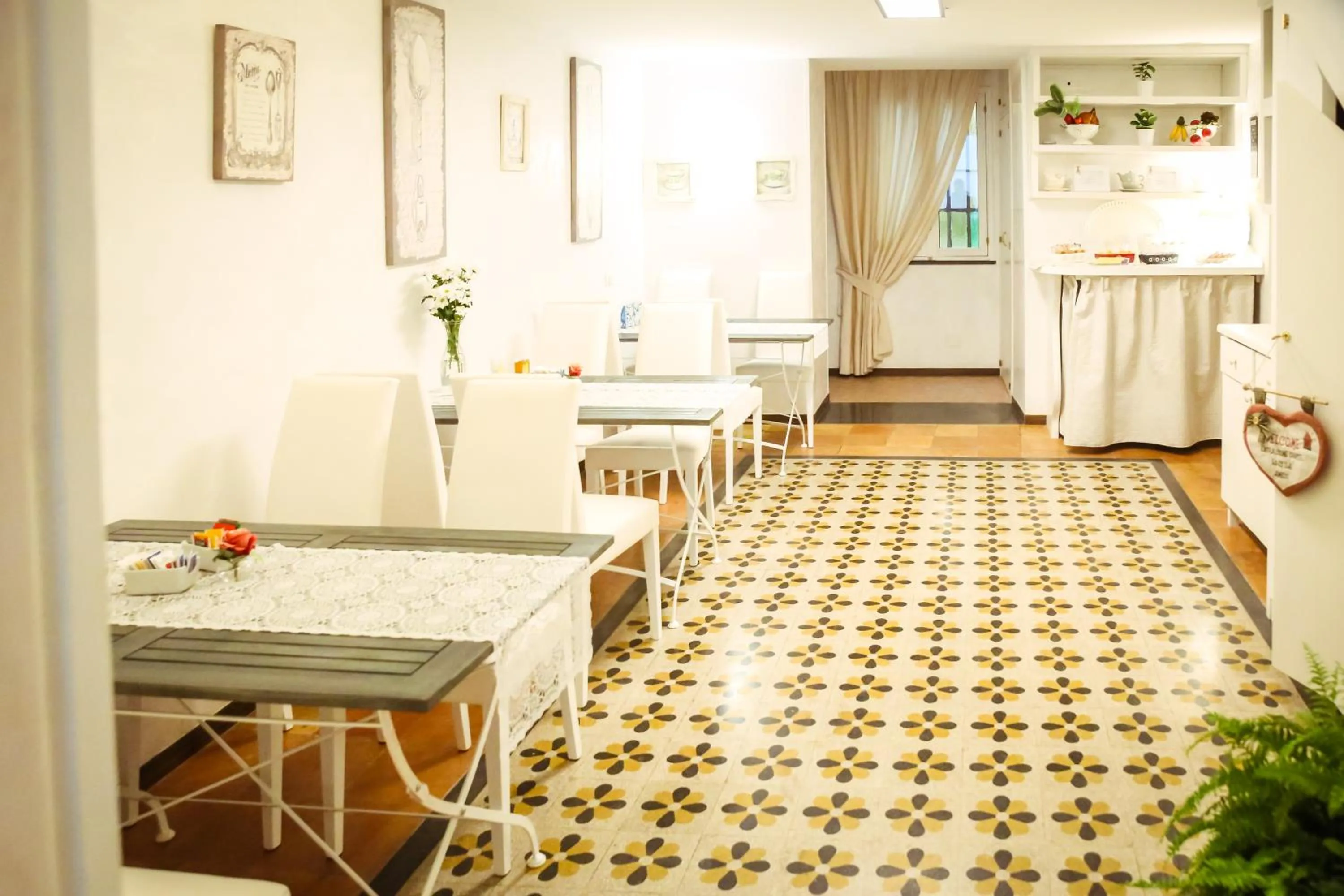 Communal lounge/ TV room in NapoliMia Boutique Hotel