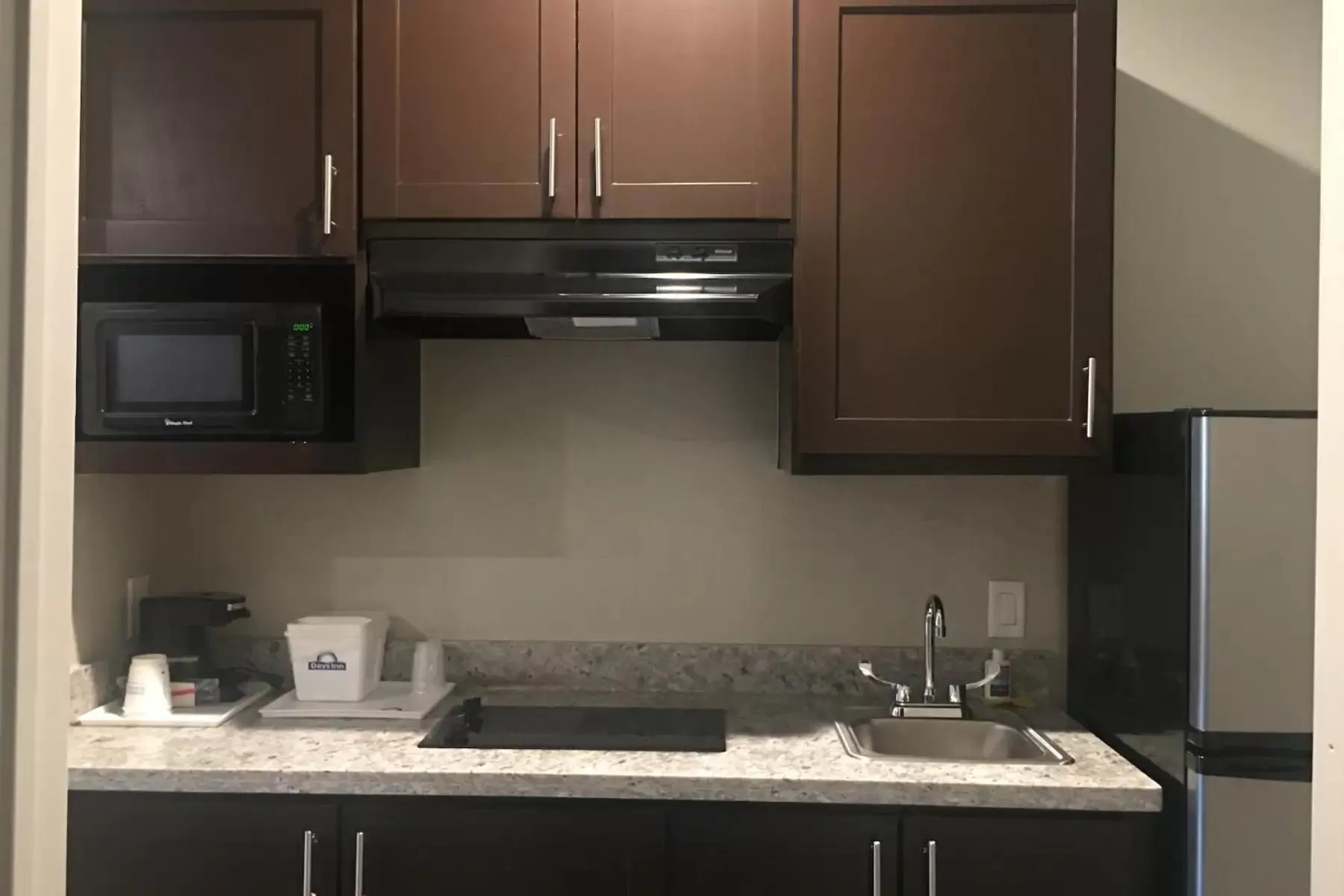 Kitchen or kitchenette in Days Inn & Suites by Wyndham La Porte