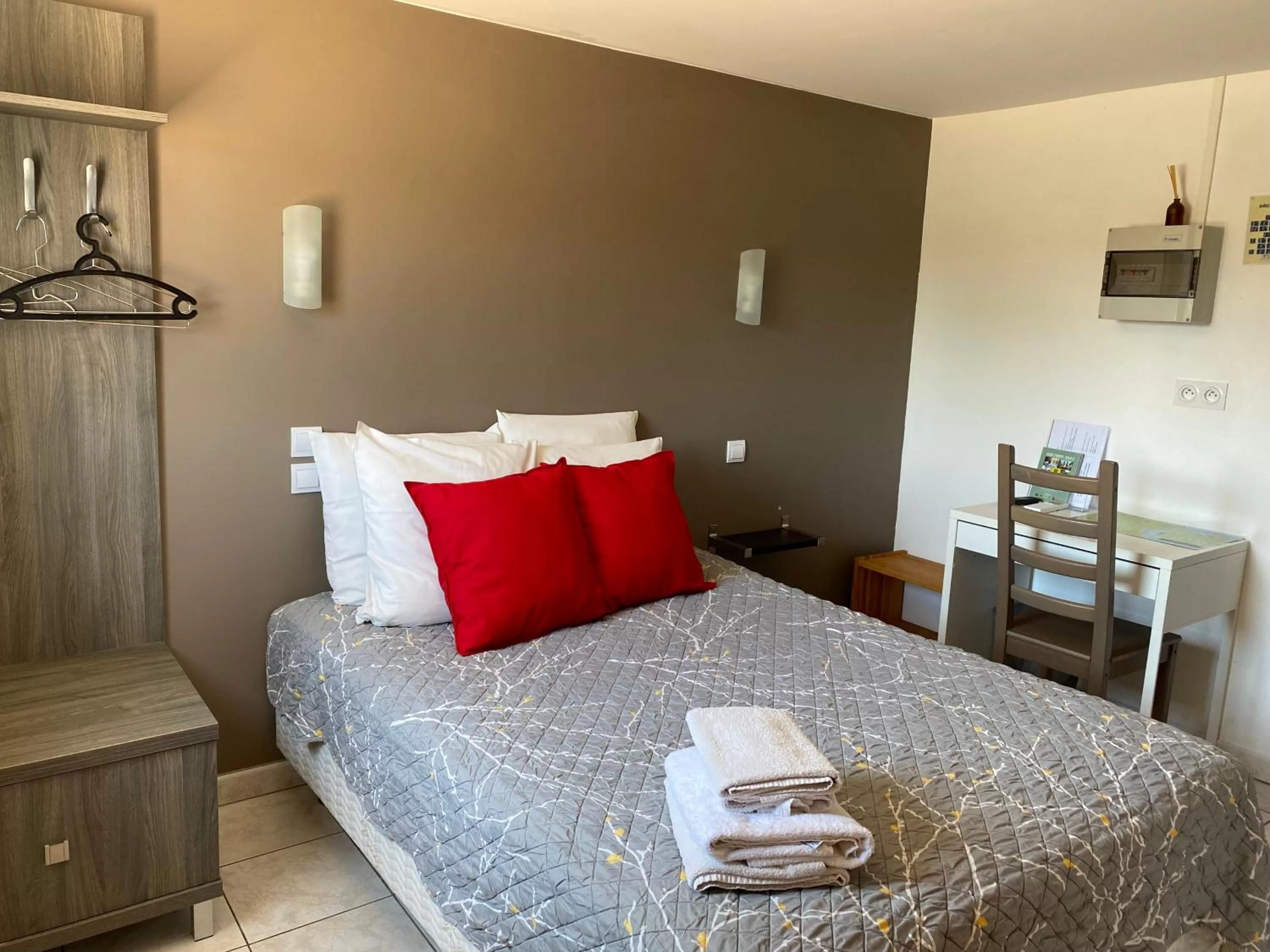 Bed in LOGIS Hôtel La Chaumière