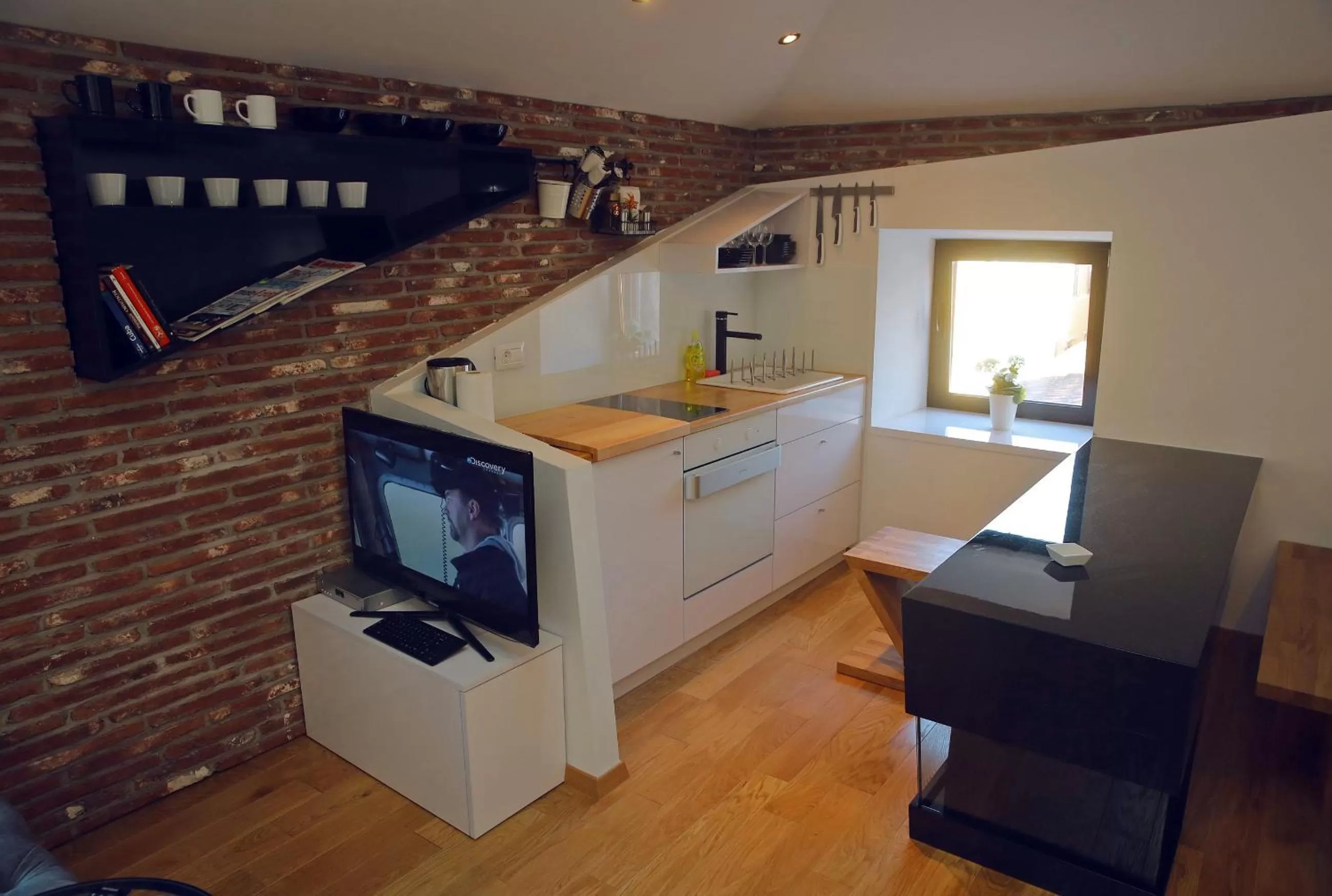 TV and multimedia in Central Apartments Integrated Hotel